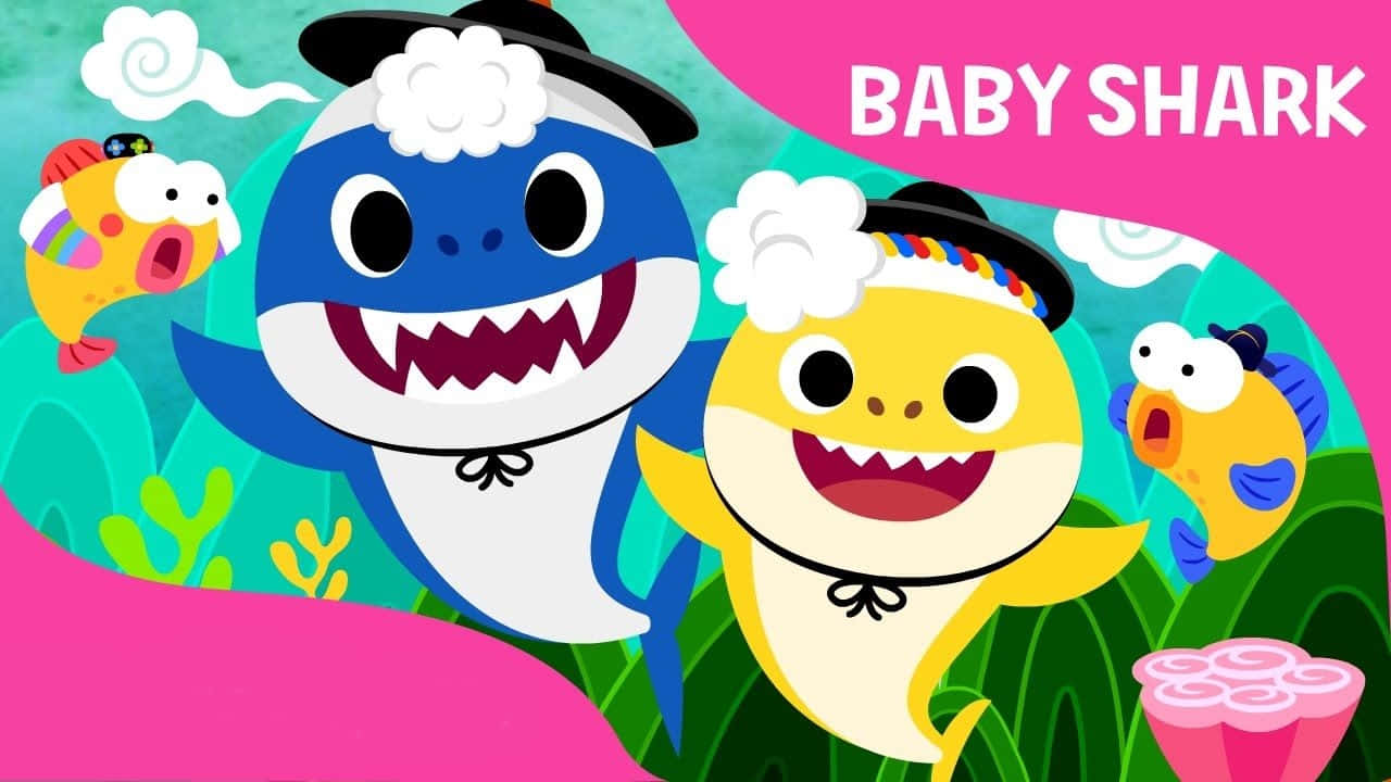 baby shark 桌布 壁紙 — Baby Shark 和朋友們在色彩繽紛的卡通水下場景中，與珊瑚和魚兒一起快樂地唱歌。