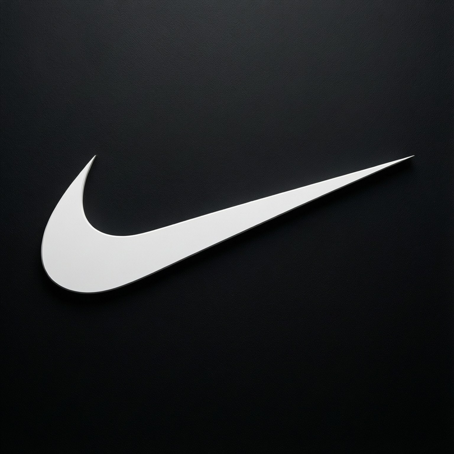 Minimalist White Swoosh 壁紙 — 一個時尚的白色Nike swoosh標誌在帶有柔和照明的紋理黑色背景上脫穎而出。