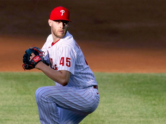 棒球投手身穿細條紋制服蹲在球場上 — MLB 壁紙