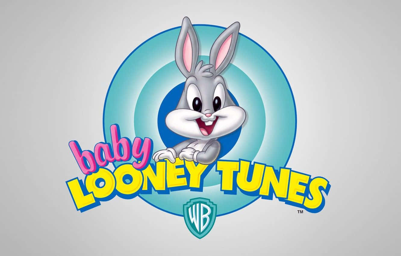 兔巴哥 桌布 壁紙 — BB Bugs Bunny 在藍色目標圓圈內開心微笑，帶有 'baby LOONEY TUNES' 文字和 Warner Bros 標誌。
