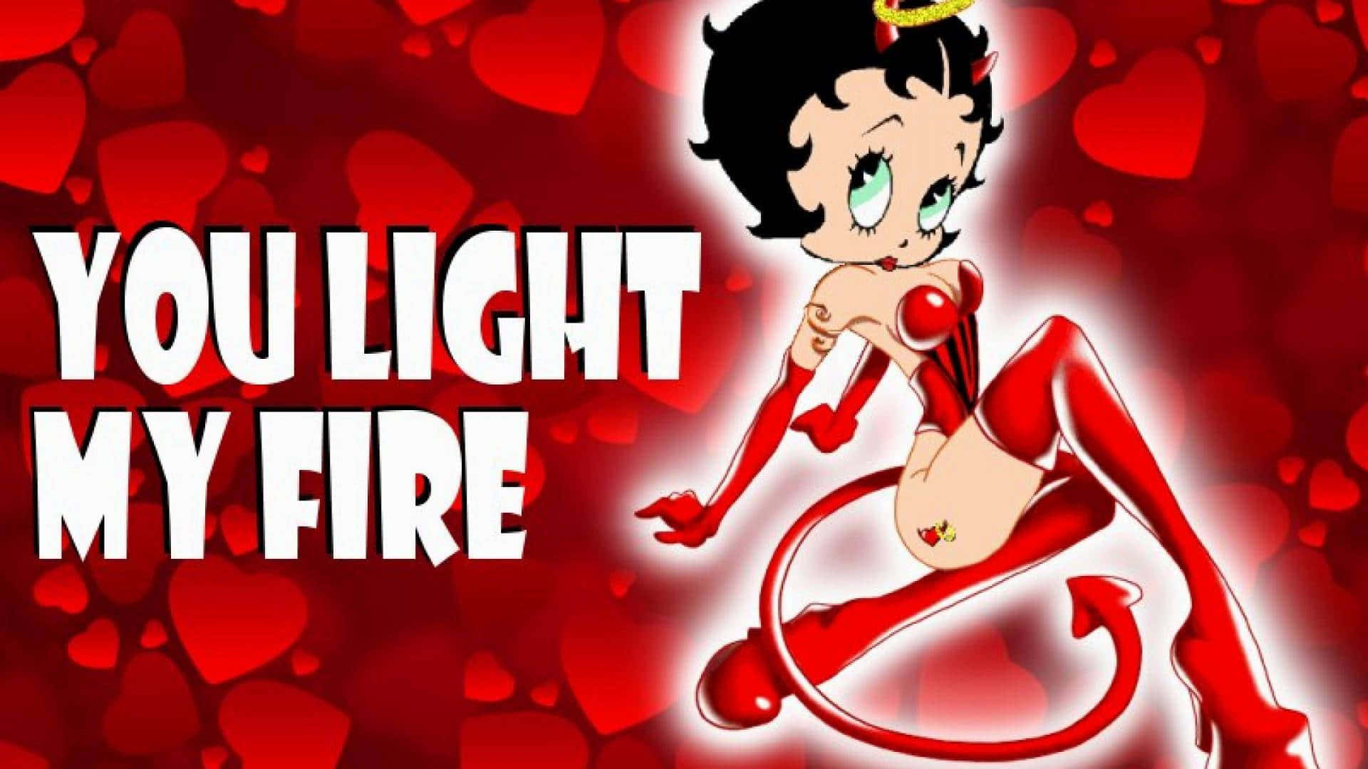 Betty Boop Christmas 桌布 壁紙 — Betty Boop 化身為魔鬼，擁有紅色角和尾巴，在紅色心形背景上以粗體文字誘人地擺姿勢。