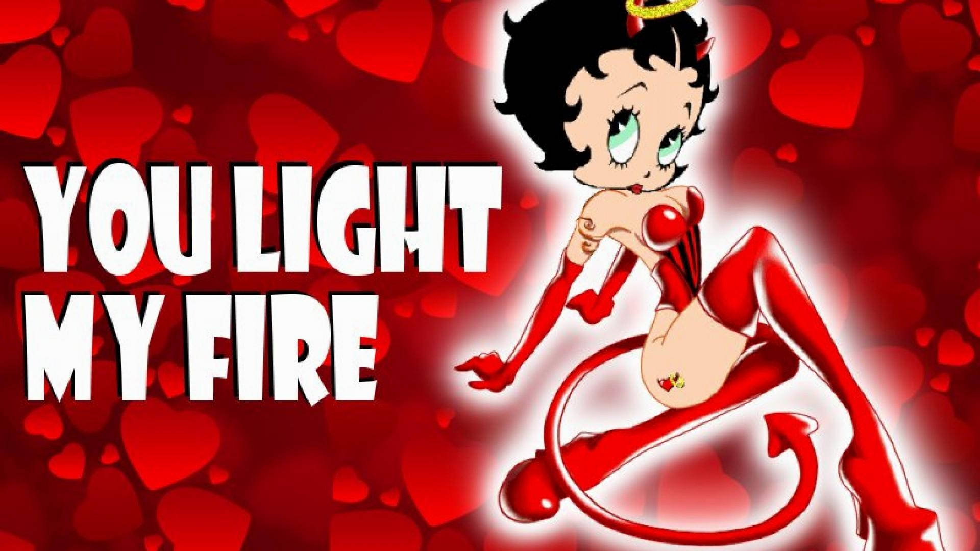 boop 桌布 壁紙 — Betty Boop 化身為魔鬼，擁有紅色角和尾巴，在紅色心形背景前誘人地擺姿勢，並配有粗體文字。
