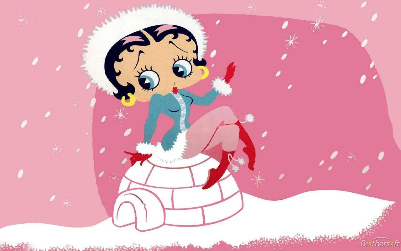 boop 桌布 壁紙 — Betty Boop 戴著冬季帽子和外套坐在冰屋頂上，雪花在粉紅色的天空下飄落。