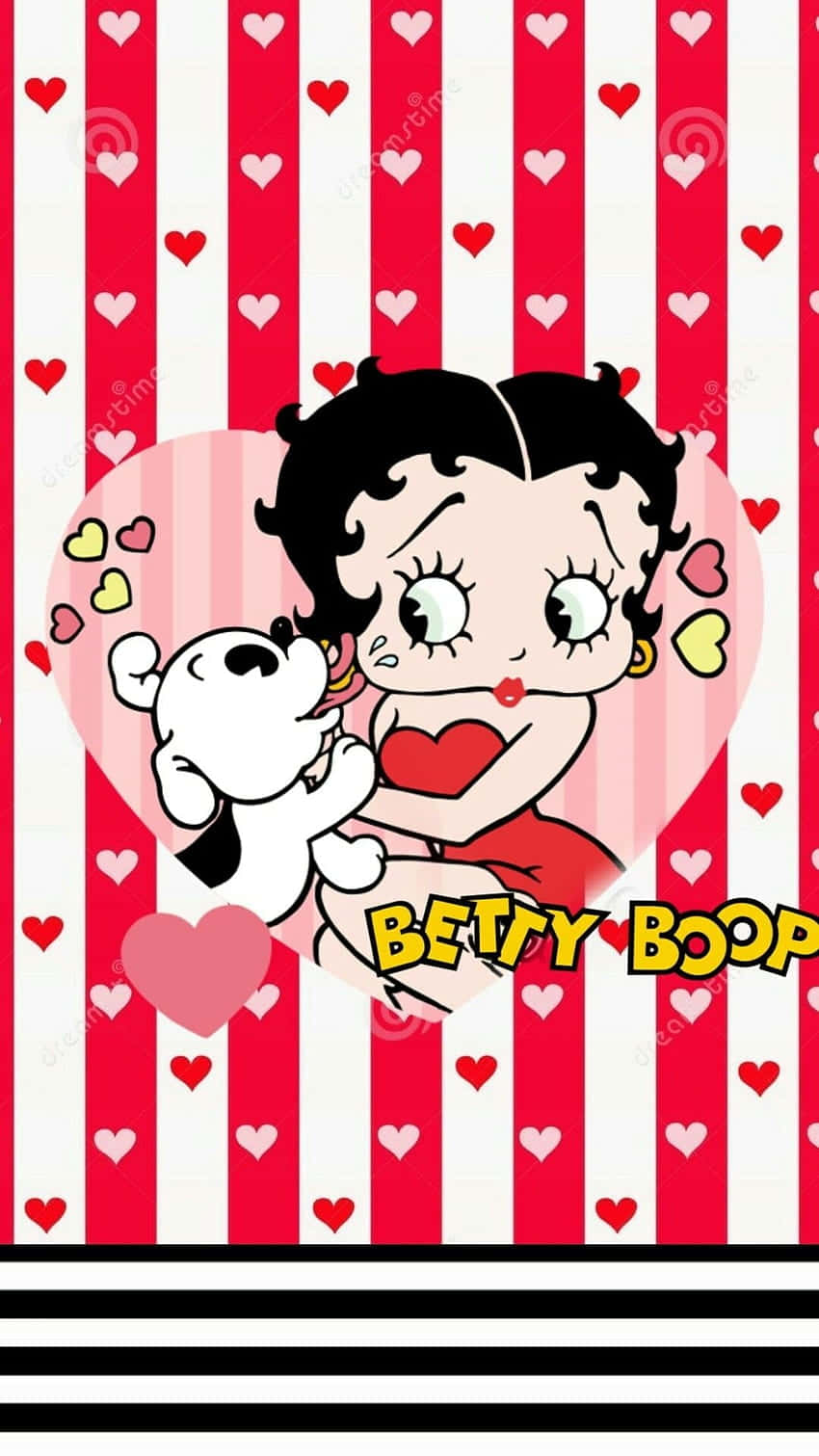 Betty Boop Christmas 桌布 壁紙 — Betty Boop 穿著紅色連衣裙，在紅白條紋背景上擁抱一隻白狗，周圍散落著心形圖案。