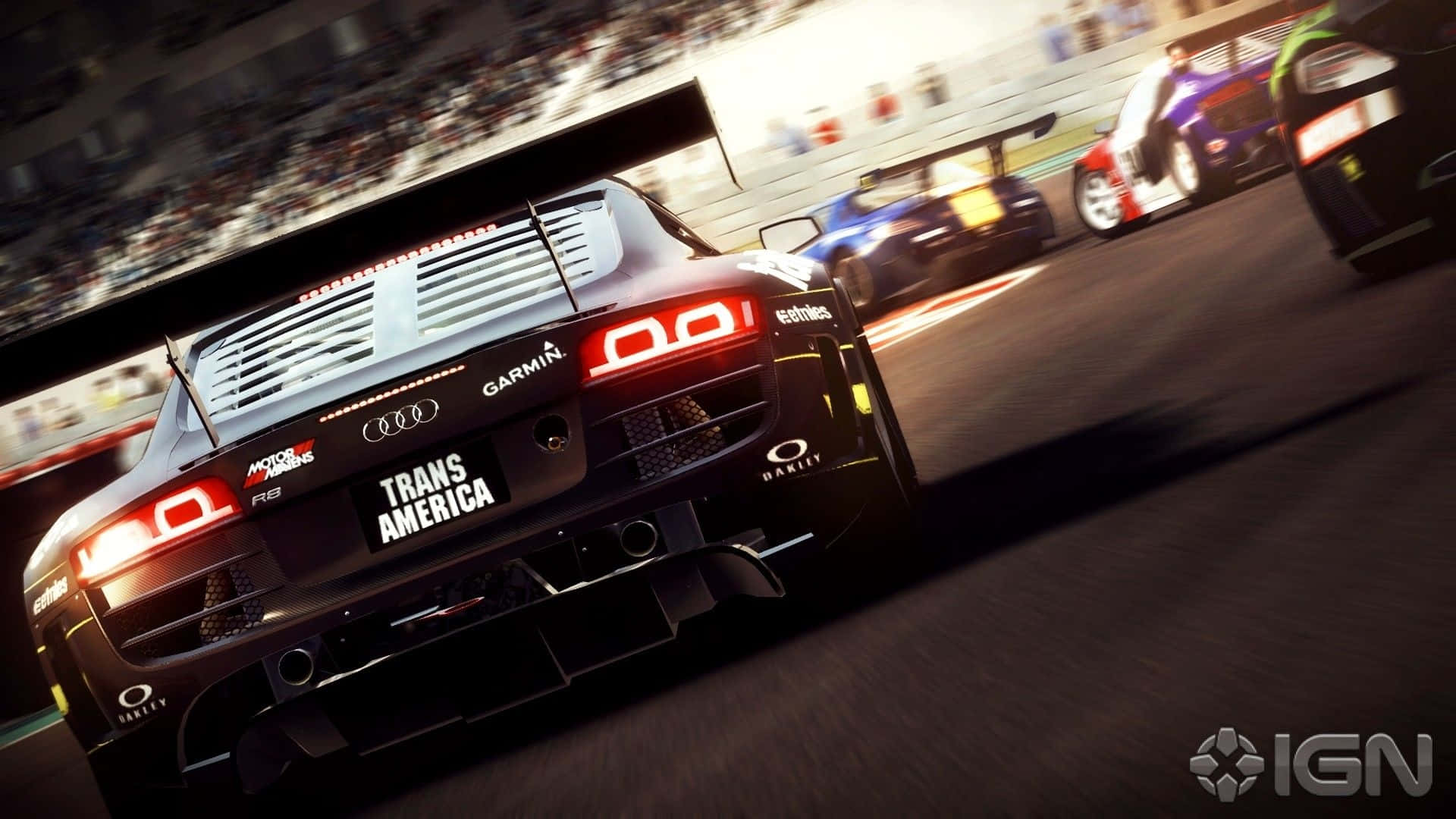 黑色奧迪賽車在賽道上疾馳，有競爭對手和觀眾。 — Project Cars 2 壁紙