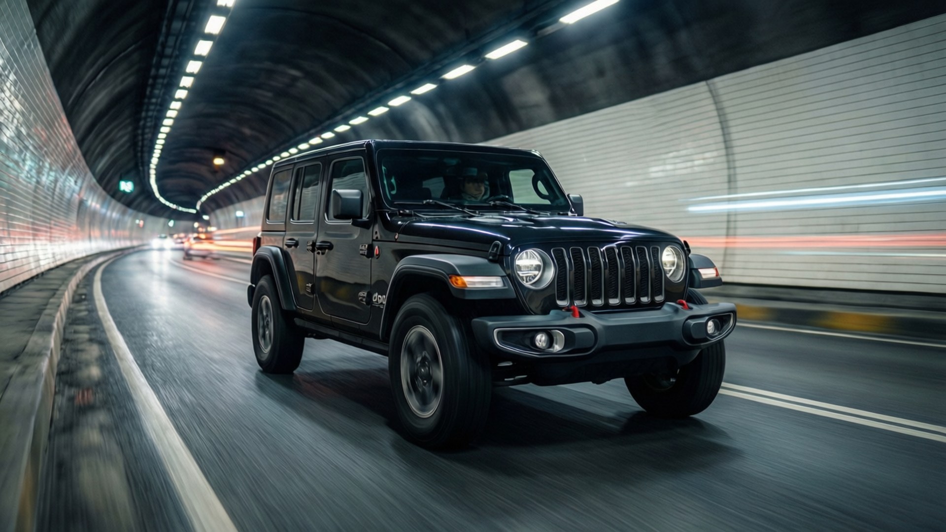 Tunnel Speed Jeep 壁紙 — 一輛黑色Jeep Wrangler在隧道中疾駛，背景有模糊的光線條紋。