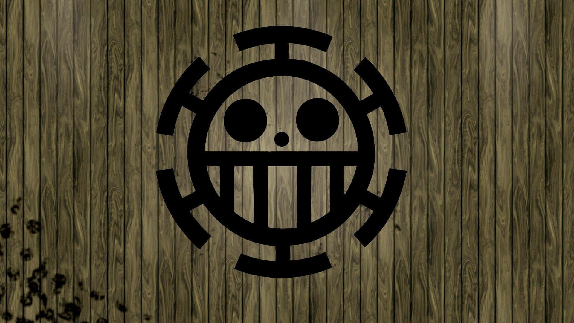  壁紙 — 一面黑色海盜旗Jolly Roger，上面有咧嘴笑的骷髏頭和交叉骨頭圖案，背景是風化的木板。