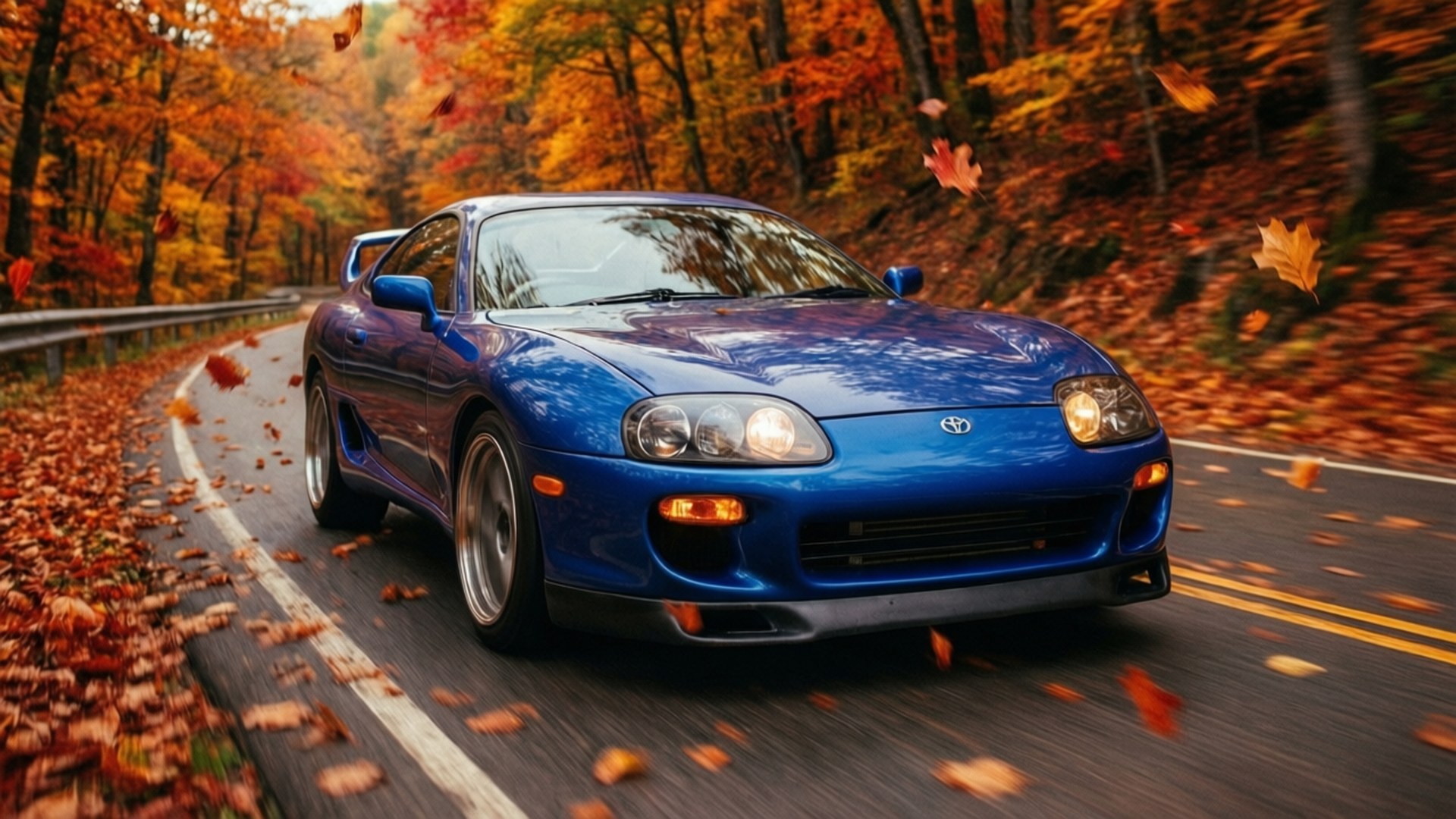 藍色跑車在森林中鋪滿秋葉的道路上行駛 — Jdm 壁紙