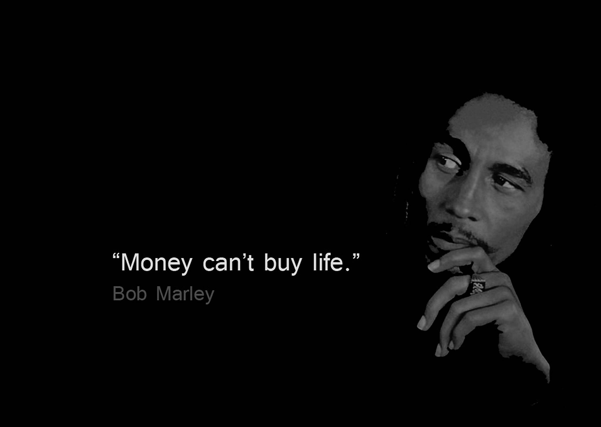 bob 桌布 壁紙 — Bob Marley 以黑白風格呈現於深色背景，附有其名言金錢買不到生命。