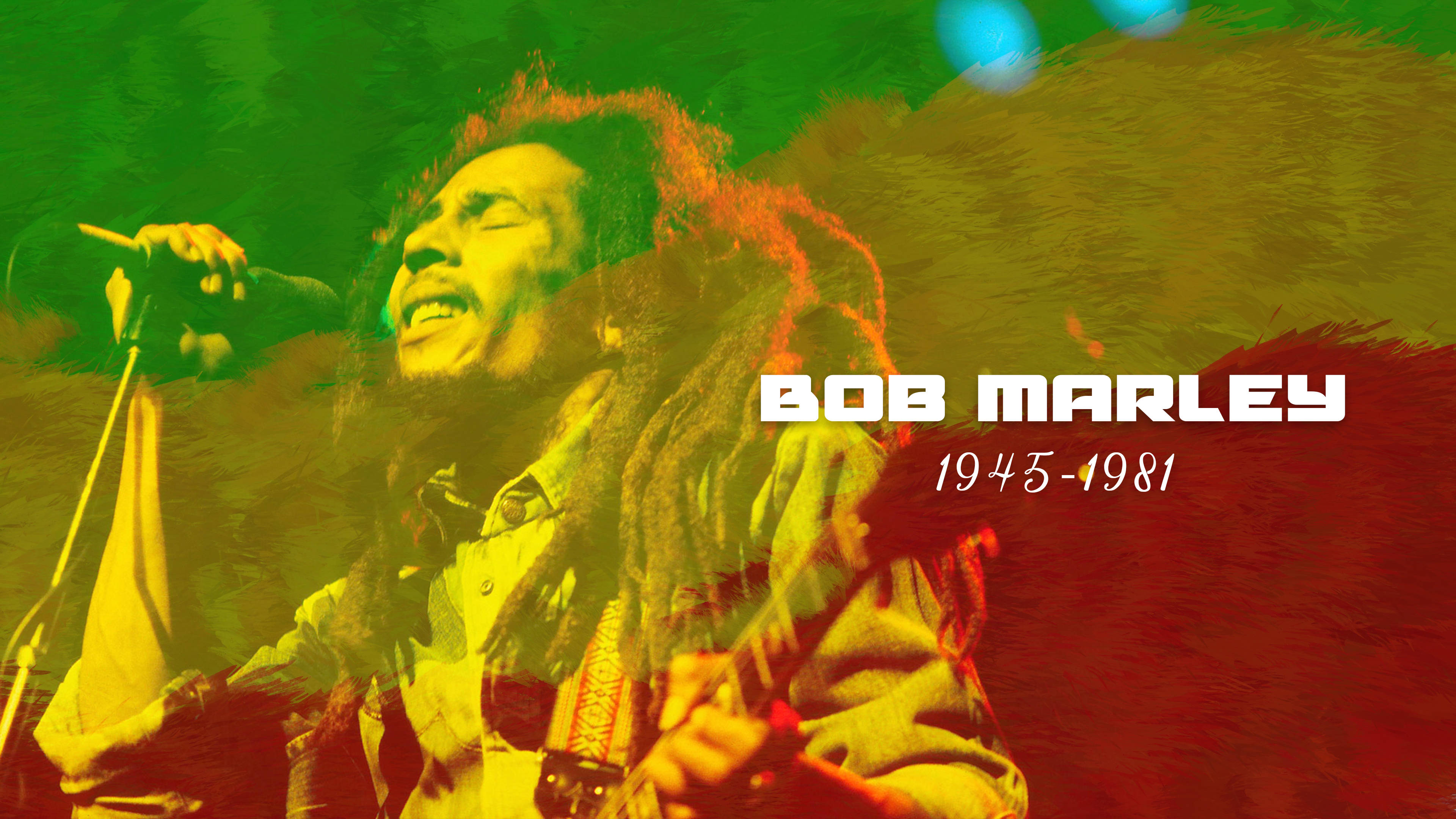 Bob Marley 桌布 壁紙 — Bob Marley 在充滿活力的綠色和紅色舞台燈光下熱情地對著麥克風唱歌，並顯示他的名字和年份。