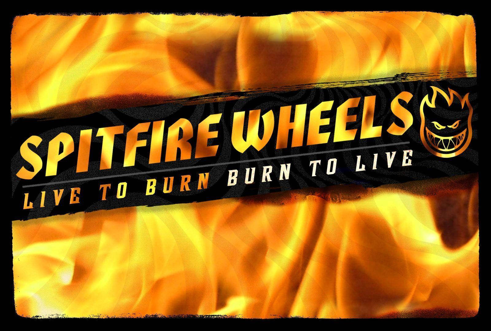 火焰動畫 桌布 壁紙 — Spitfire Wheels 的醒目火焰標誌，帶有侵略性吉祥物和標語，背景是熾熱的橙色火焰。