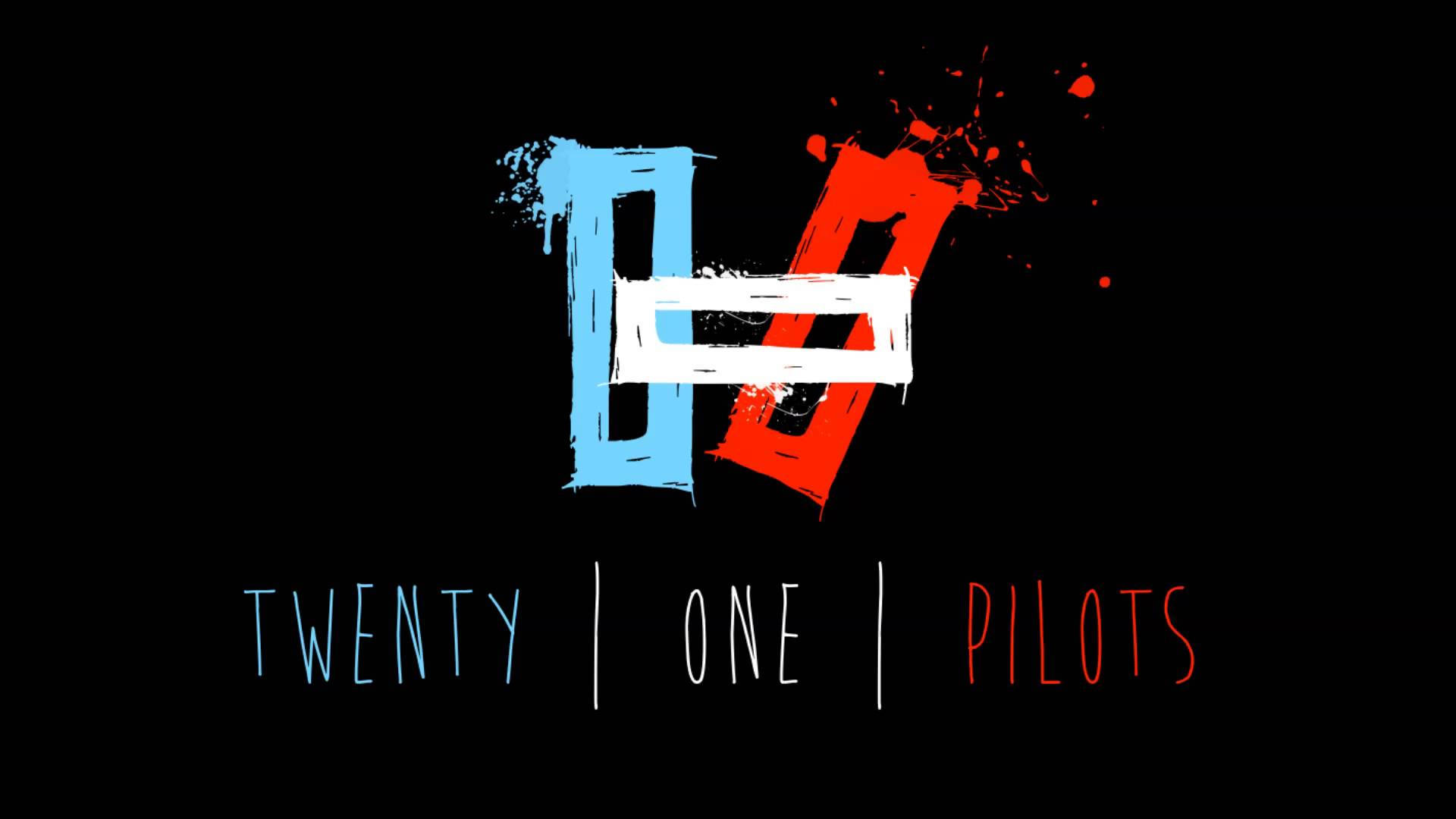 Twenty 桌布 壁紙 — Twenty One Pilots 的醒目塗鴉風格標誌，黑色背景上帶有藍色和紅色的飛濺數字。