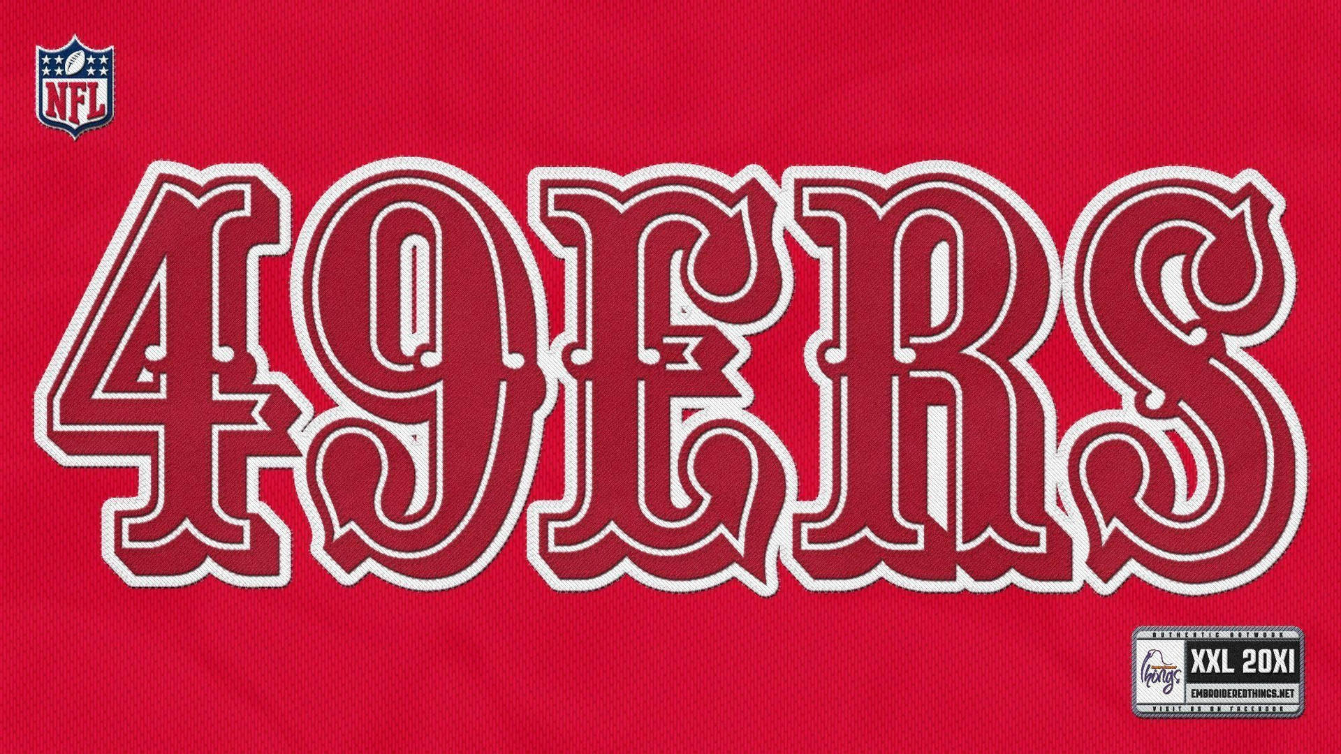 紅色49ers NFL球衣特寫，帶有白色字體和尺寸標籤。 — 49Ers 壁紙