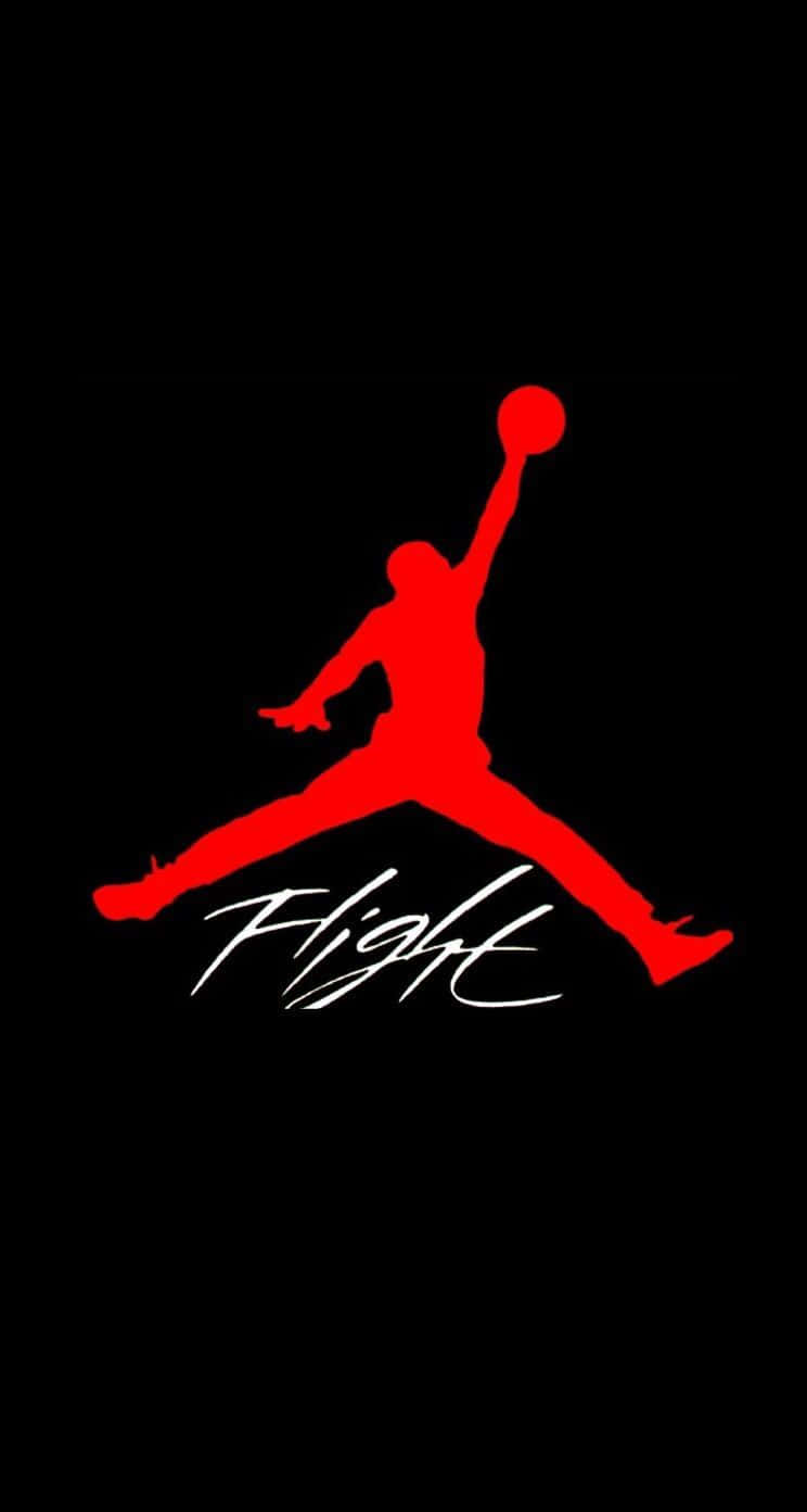 黑色背景上帶有「Flight」文字的紅色Jumpman標誌 — Jordan Logo 壁紙