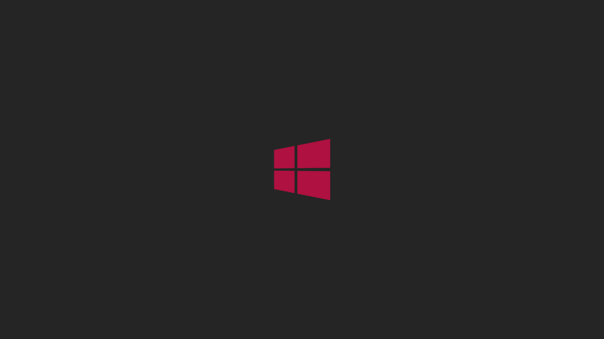 深灰色背景上的紅色Windows標誌 — Windows 11 壁紙
