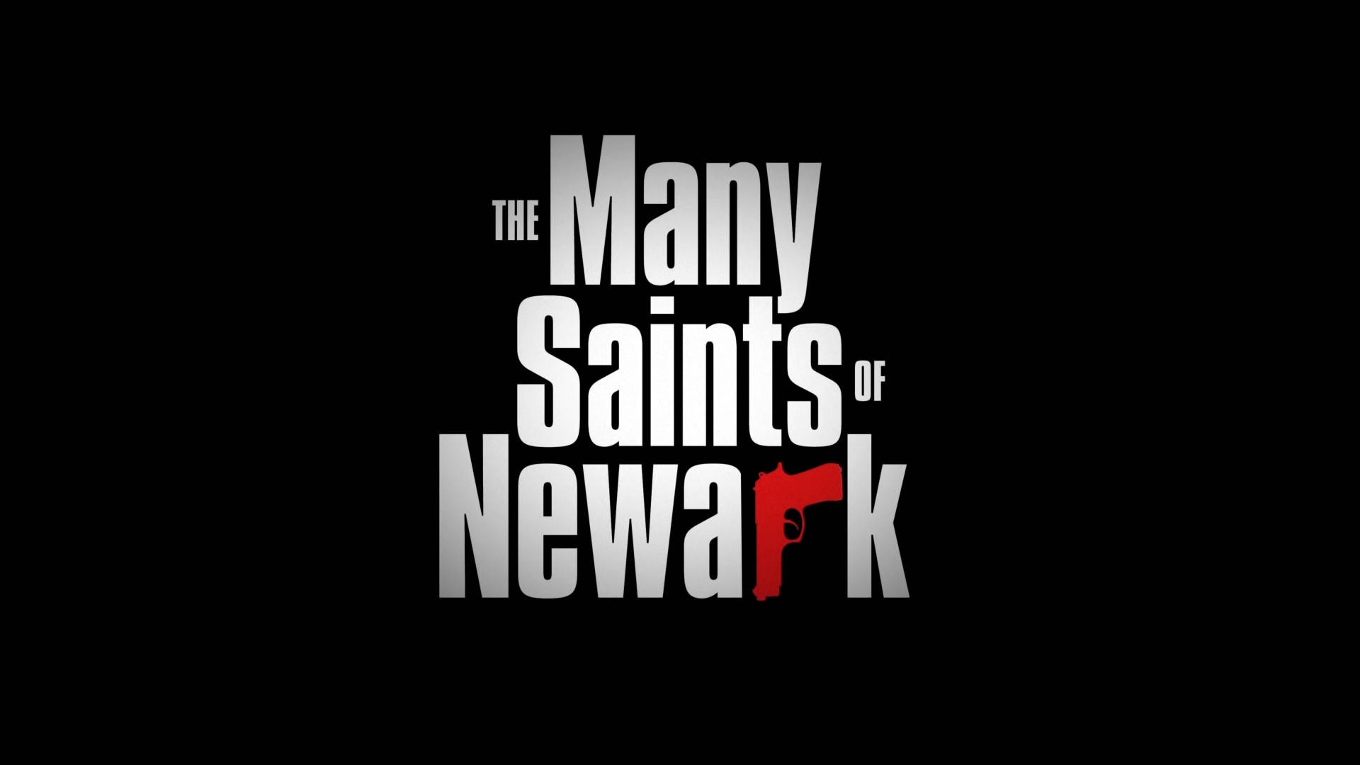 Gangster 桌布 壁紙 — 《The Many Saints of Newark》的粗體白色和紅色標題文字在純黑色背景上脫穎而出。