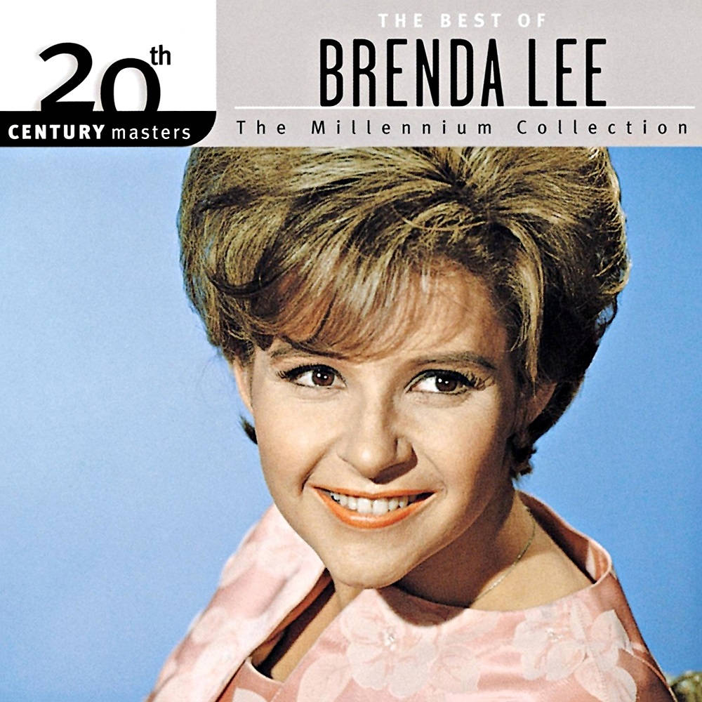 復古 桌布 壁紙 — Brenda Lee 在純藍色背景前，穿著粉紅色花卉連衣裙，在復古專輯封面上燦爛微笑。