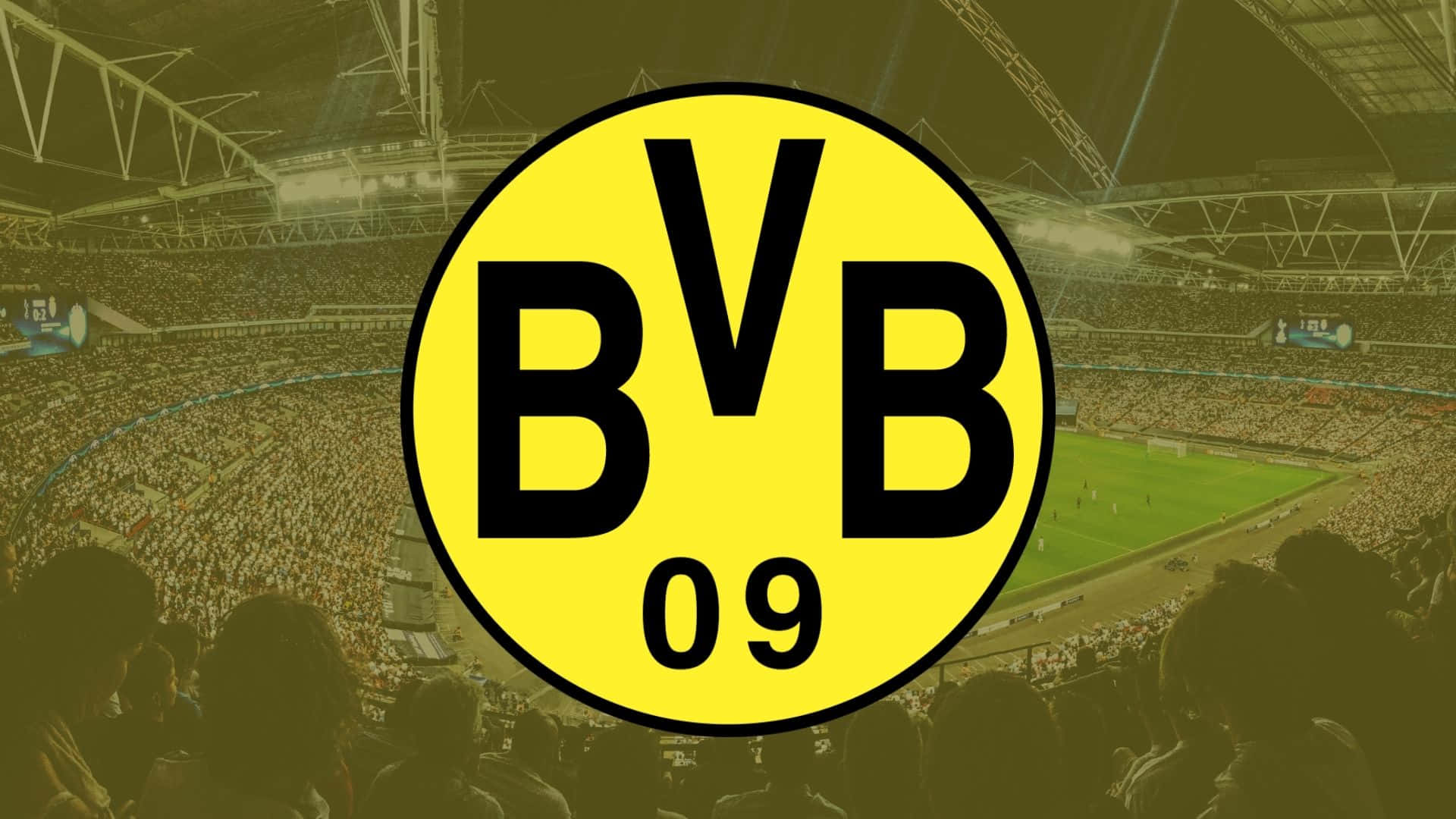 Dortmund 桌布 壁紙 — BVB 09 標誌在明亮的泛光燈下，於夜間比賽中主宰著一個擠滿人的足球場。