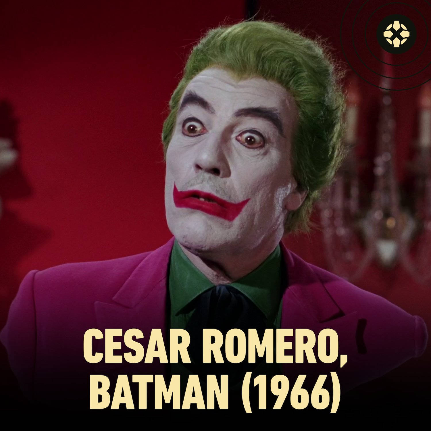 小丑 桌布 壁紙 — Cesar Romero 在1966年《蝙蝠俠》中飾演小丑，綠色頭髮、白色臉龐、紅色嘴唇、紫色西裝，背景為紅色。