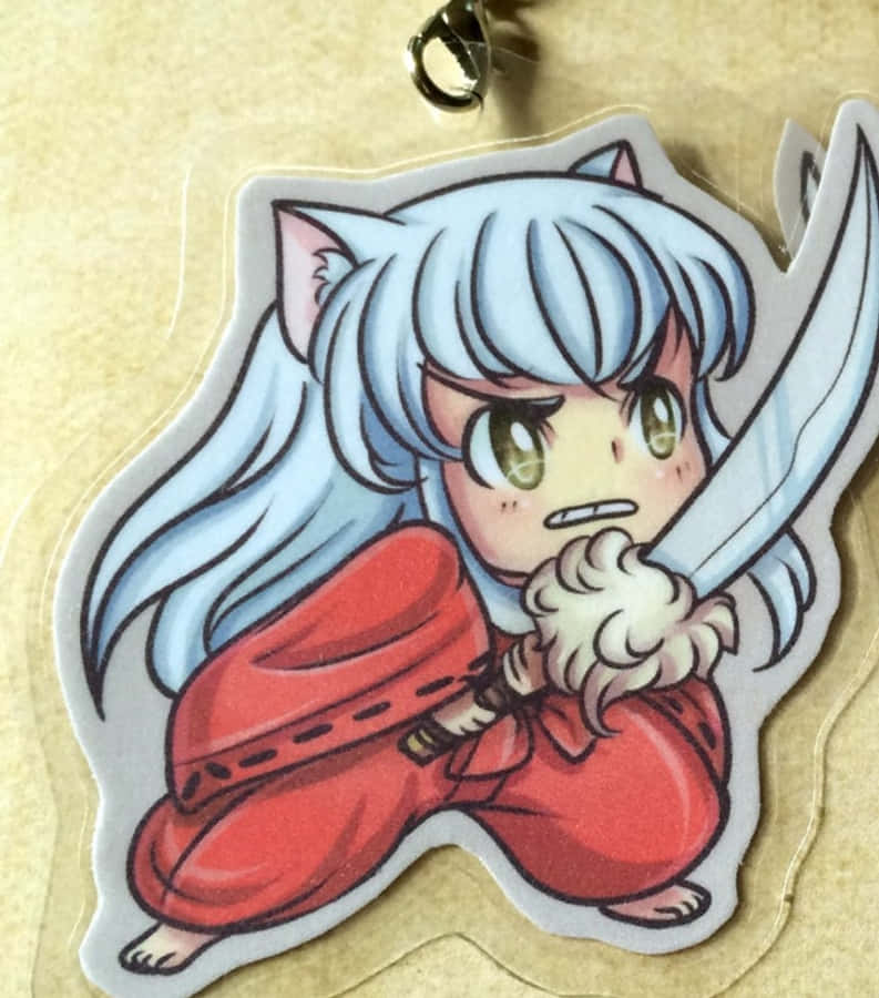Inuyasha And Tessaiga 桌布 壁紙 — 銀髮貓耳Q版動漫角色在透明壓克力鑰匙圈上以兇猛姿態握劍。