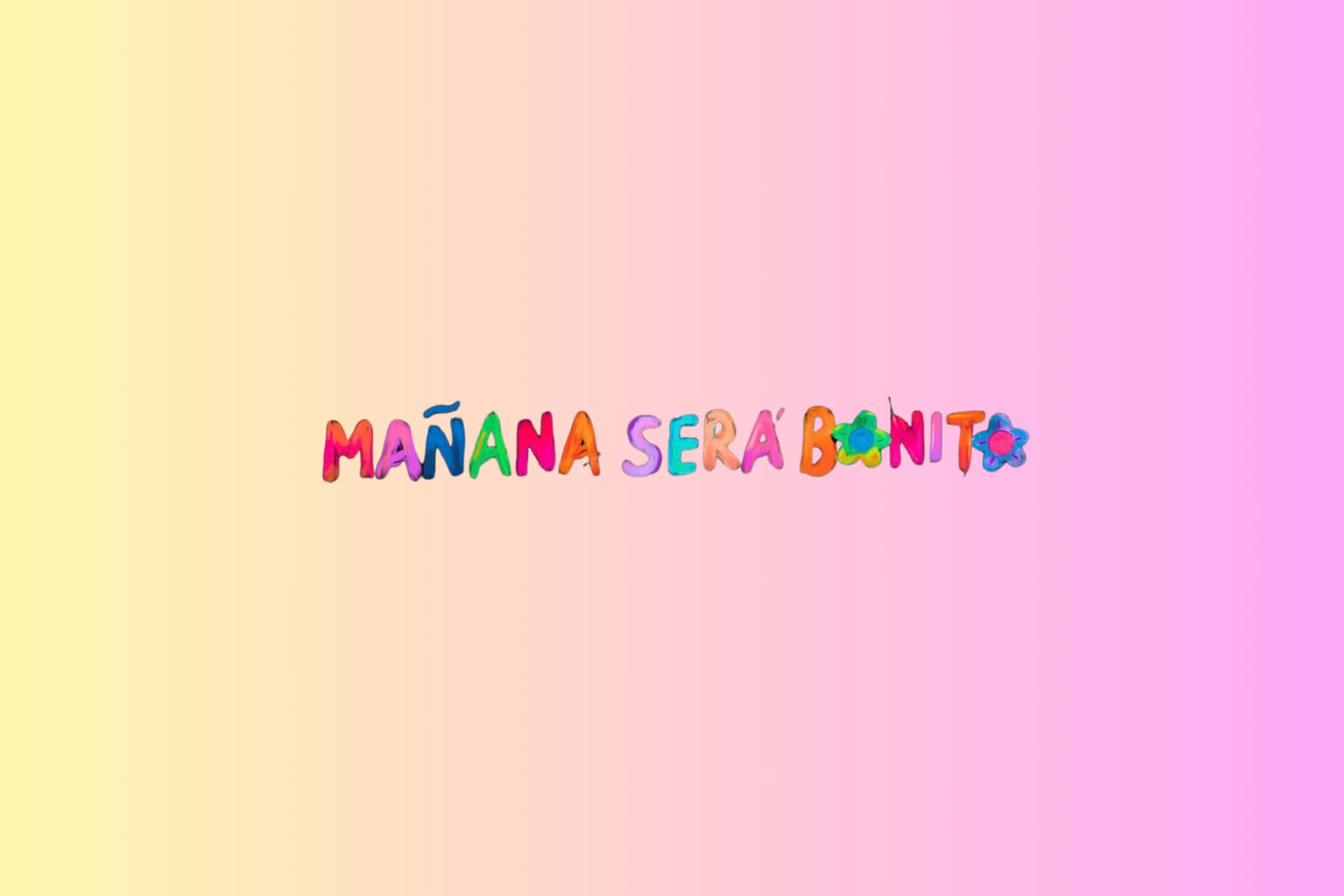  壁紙 — 充滿活力的彩虹漸變背景，帶有色彩繽紛、俏皮的文字「MAÑANA SERÁ BONITO」，並飾有花朵圖標。