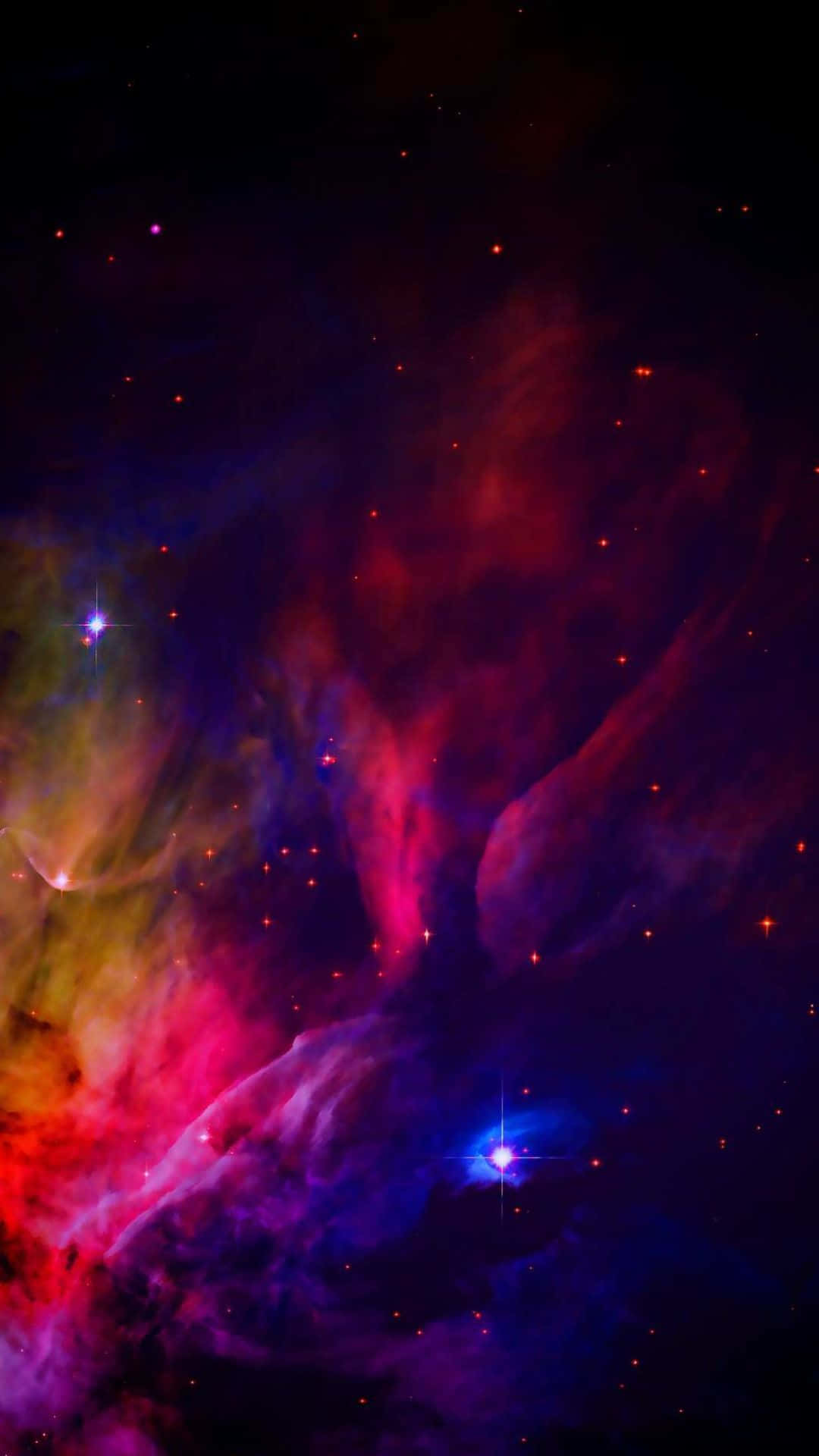 深空中帶有發光星星的彩色星雲 — iPhone 13 Pro 壁紙