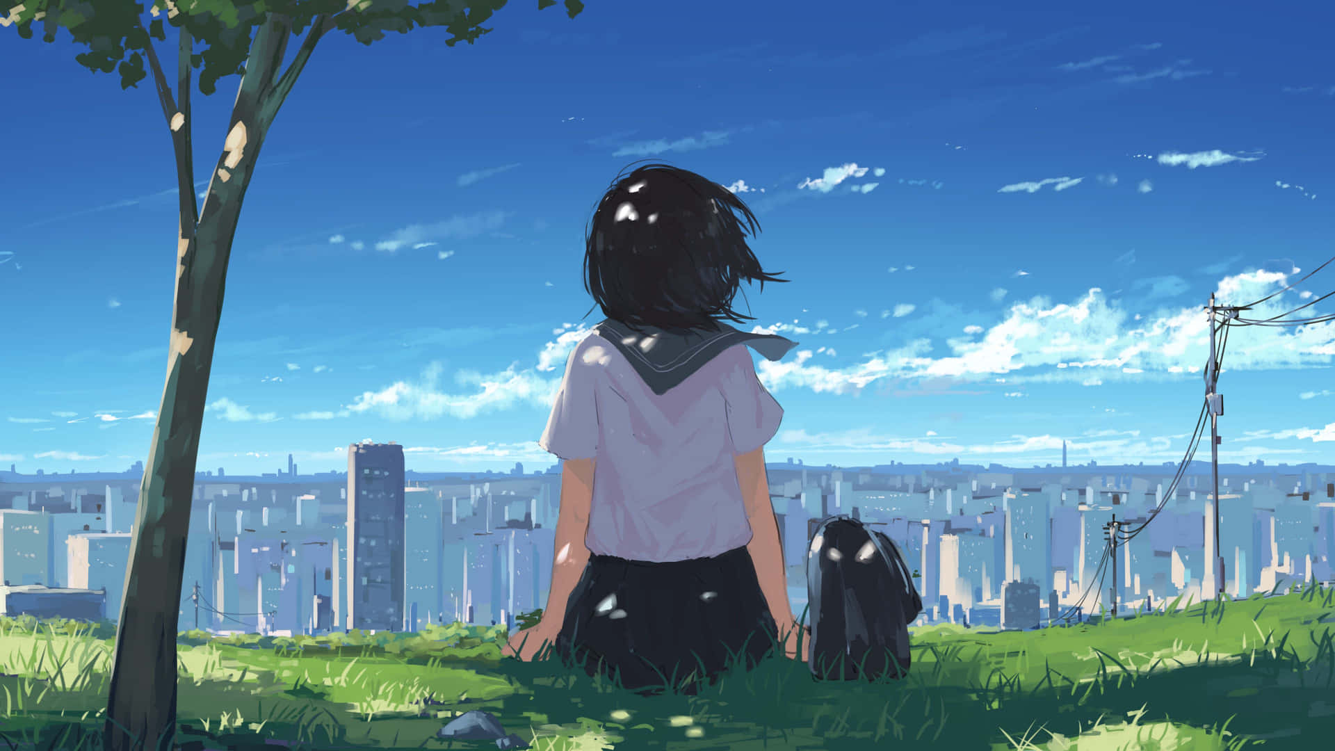 壁紙 — 一個穿著校服的女孩坐在樹下的草地上，俯瞰在晴朗藍天下的廣闊城市景觀。