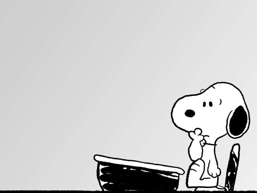 Snoopy Desktop 桌布 壁紙 — 經典黑白卡通狗史努比坐在一張簡單的椅子上，背景樸素，若有所思。