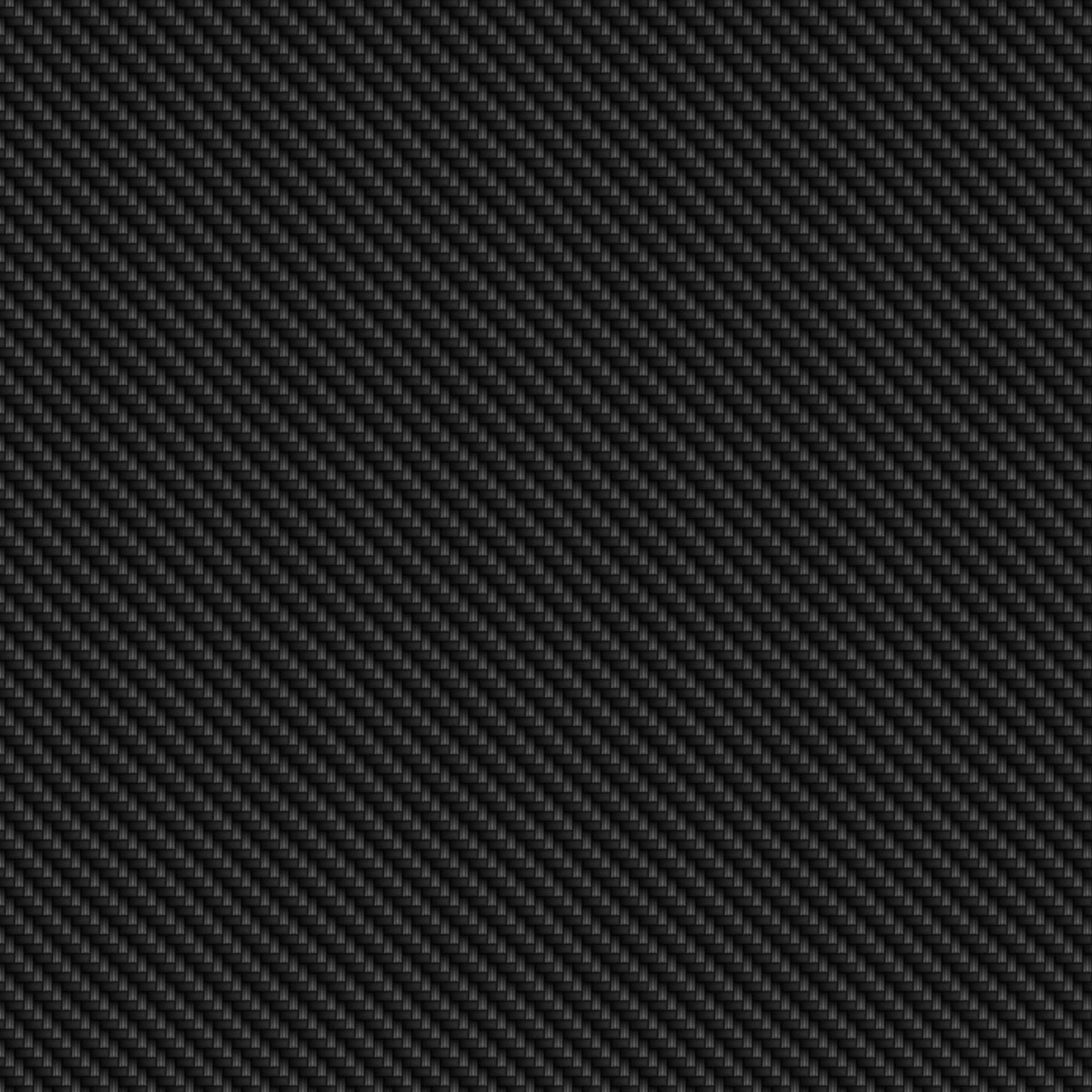 帶有對角編織圖案的黑色光滑碳纖維紋理。 — 4K 壁紙