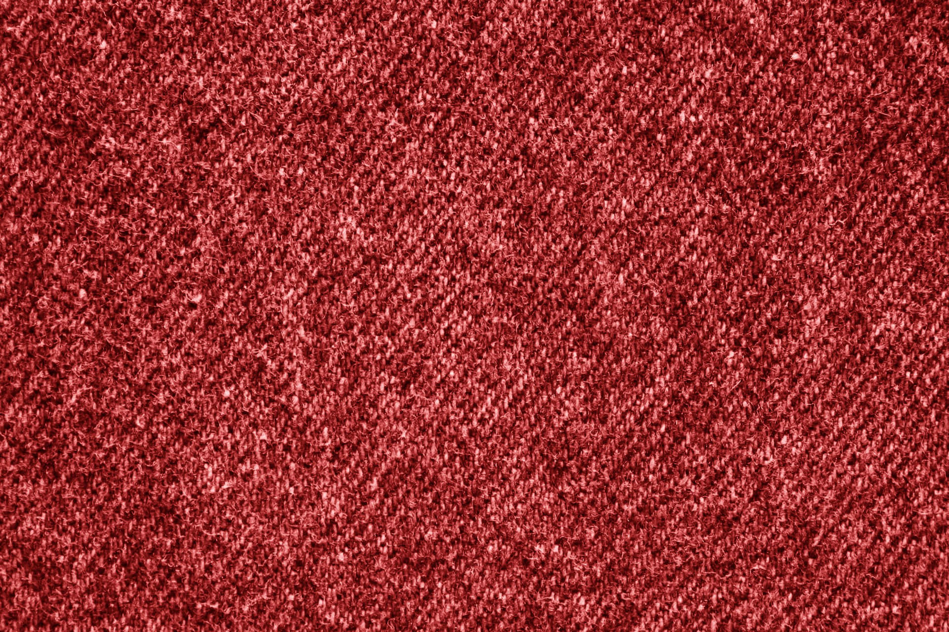近距離拍攝帶有細微光澤的深紅色紋理布料。 — Stitch 壁紙