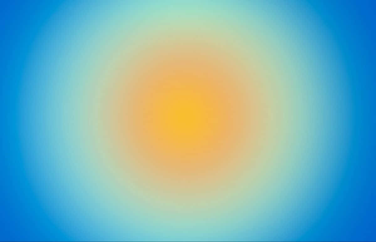  壁紙 — 從溫暖的黃色中心到清涼的藍色邊緣，一個發光的漸變旋轉，創造出柔和發光的抽象背景。