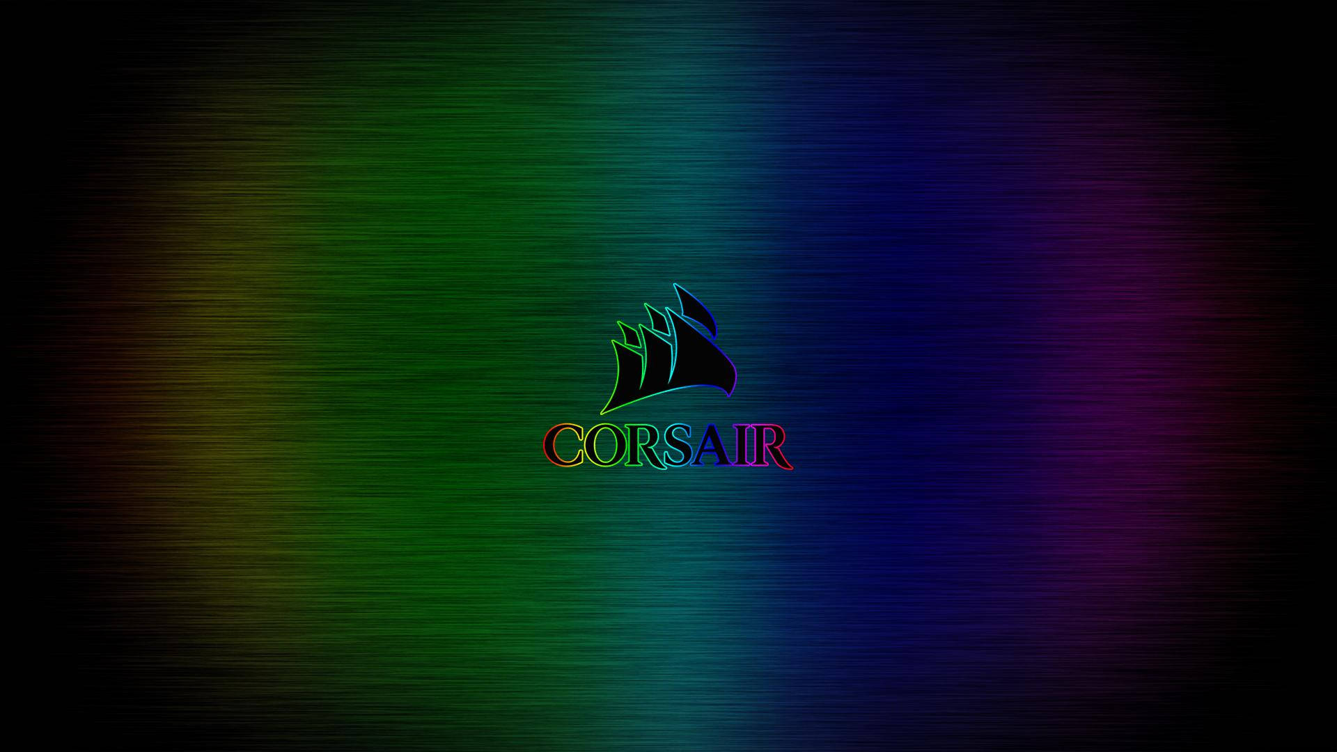 海盜船 桌布 壁紙 — Corsair 標誌在拉絲金屬漸變背景上發出彩虹色光芒。