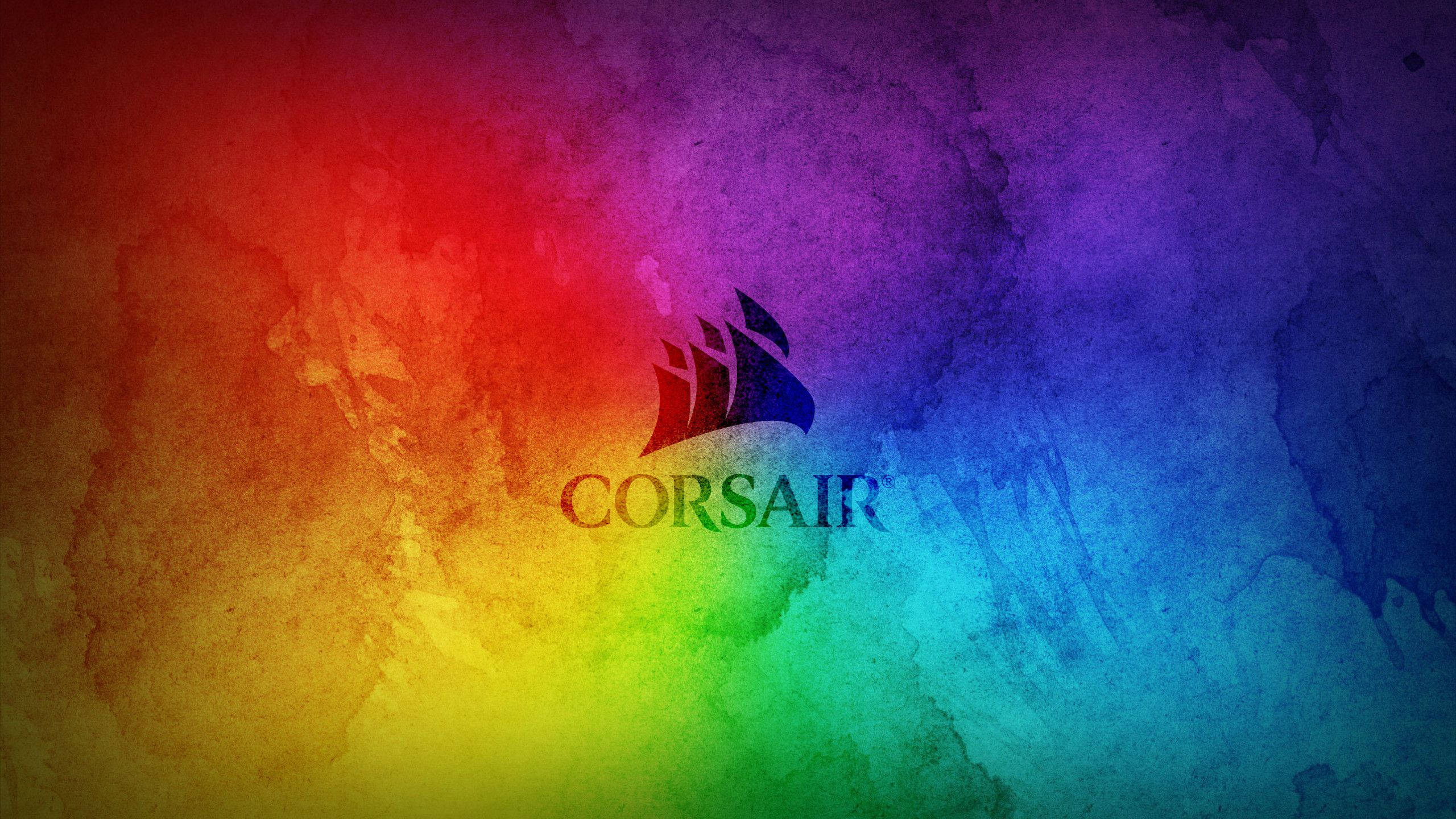 RGB 桌布 壁紙 — Corsair 標誌居中於充滿活力的彩虹水彩漸變背景上，帶有紋理筆觸。