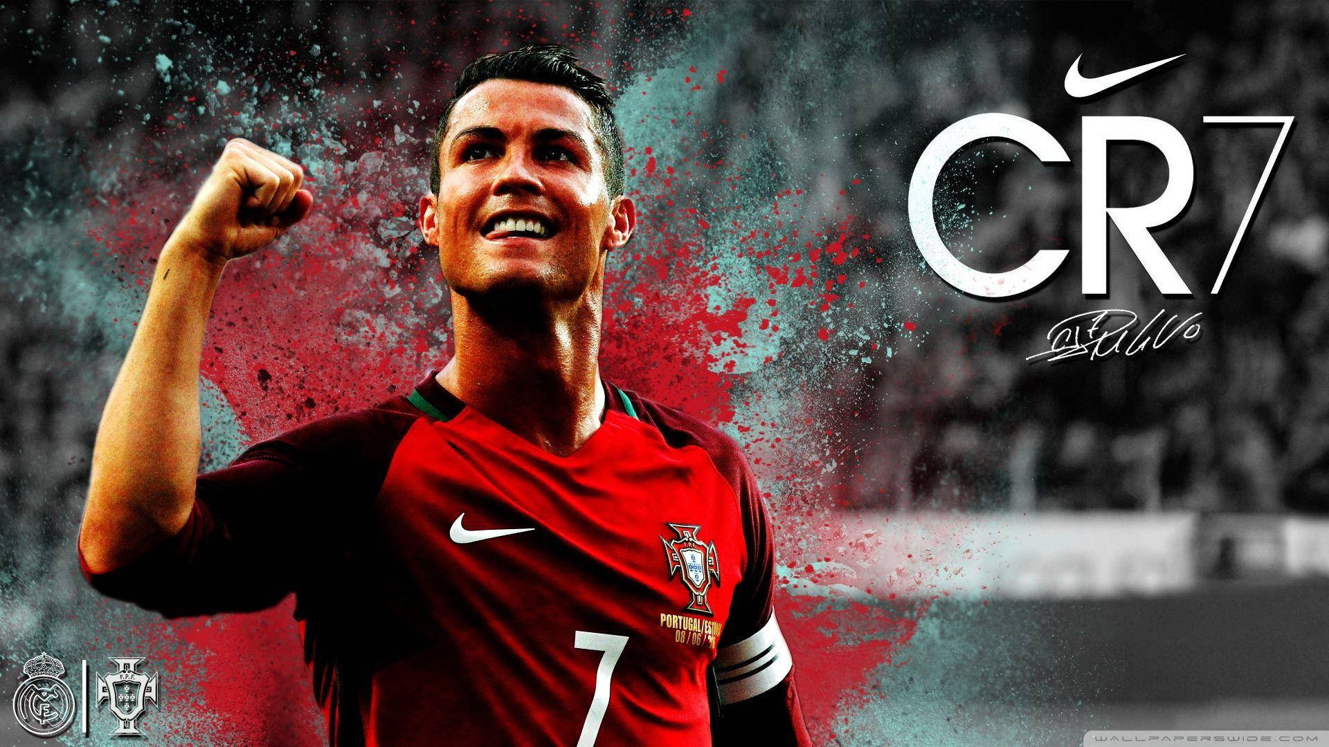 Cr7 桌布 壁紙 — C羅身穿紅色葡萄牙球衣，背後有動態的紅色和藍綠色油漆飛濺，慶祝勝利。