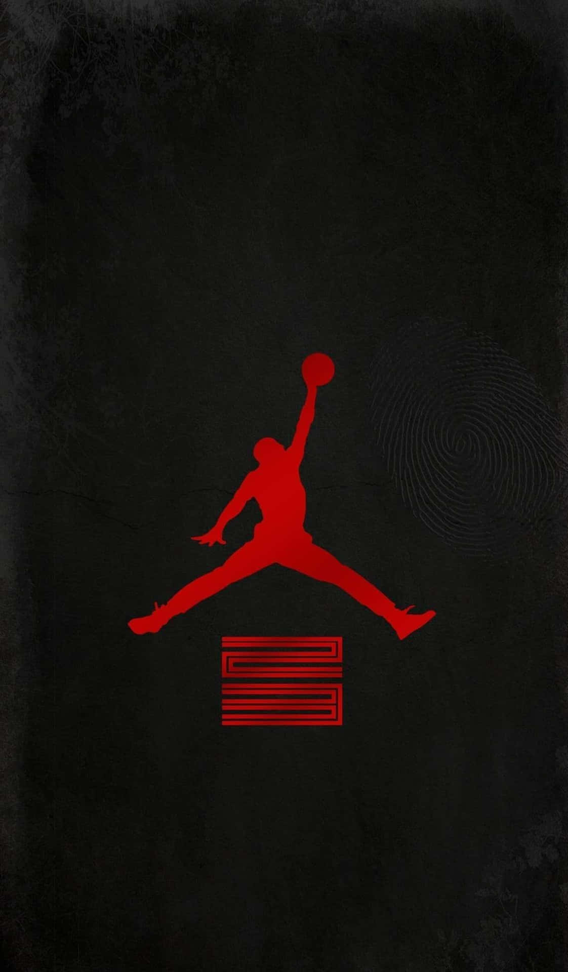 紅色Jordan標誌剪影在帶有指紋漩渦的深色紋理背景上。 — Air Jordan 壁紙