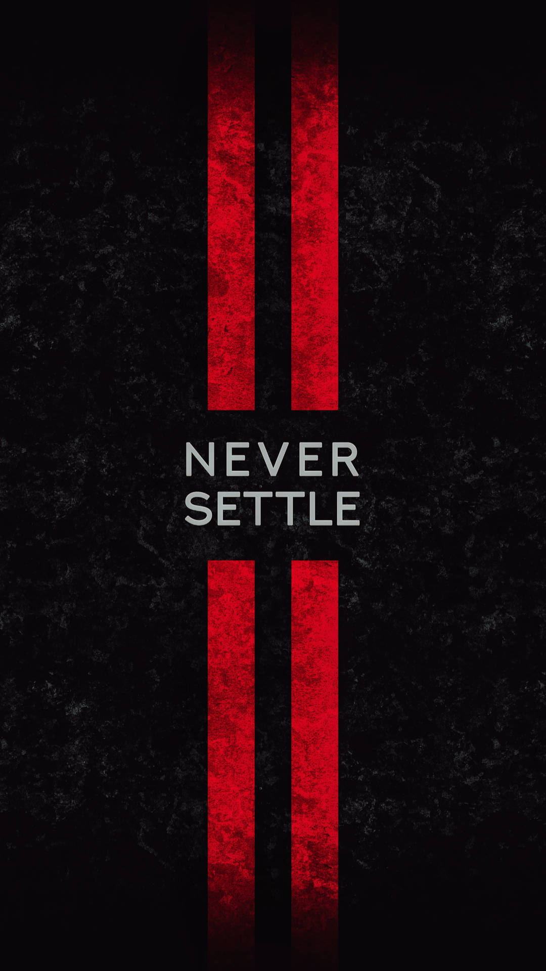 紅色條紋框住了黑色紋理背景上的 never settle 文字。 — 一加 壁紙