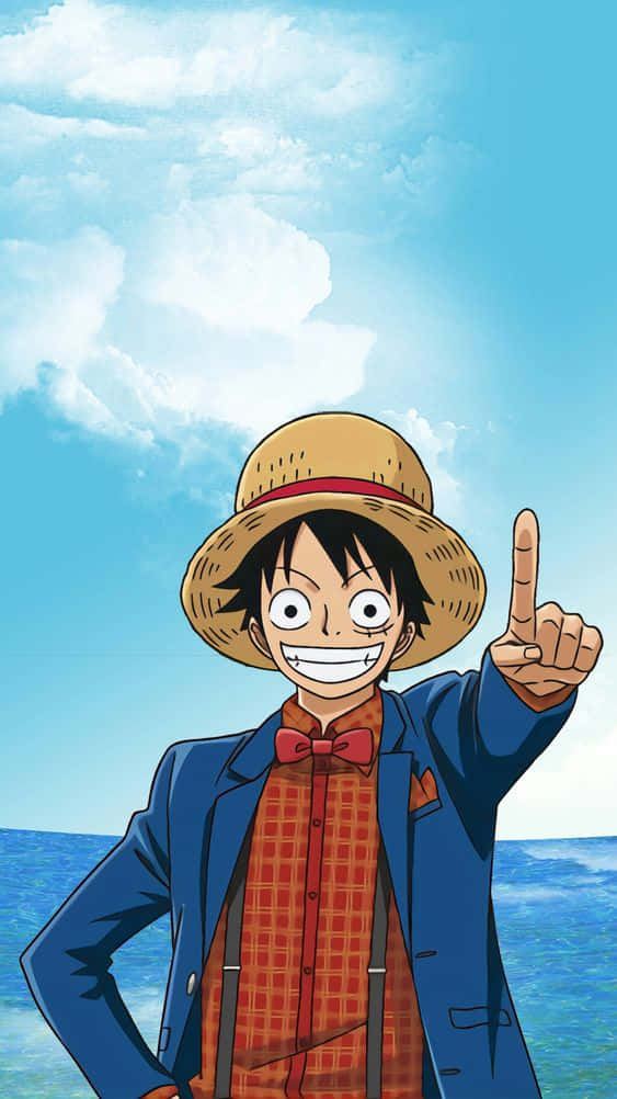  壁紙 — 一個戴草帽、穿藍色外套的開朗動畫男孩，在藍天白雲和海洋上方指向上方。