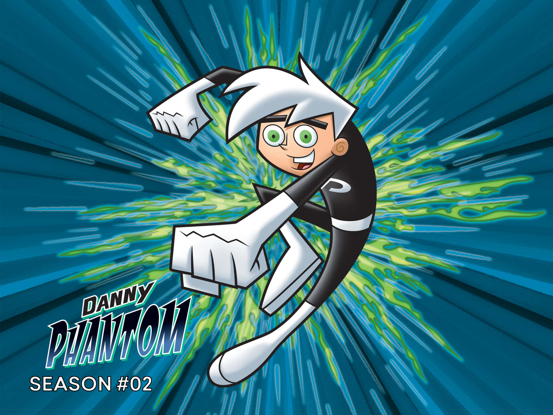 鬼魂 桌布 壁紙 — Danny Phantom 以鬼魂形態向前出拳，伴隨綠色能量爆發，背景為藍色放射狀。