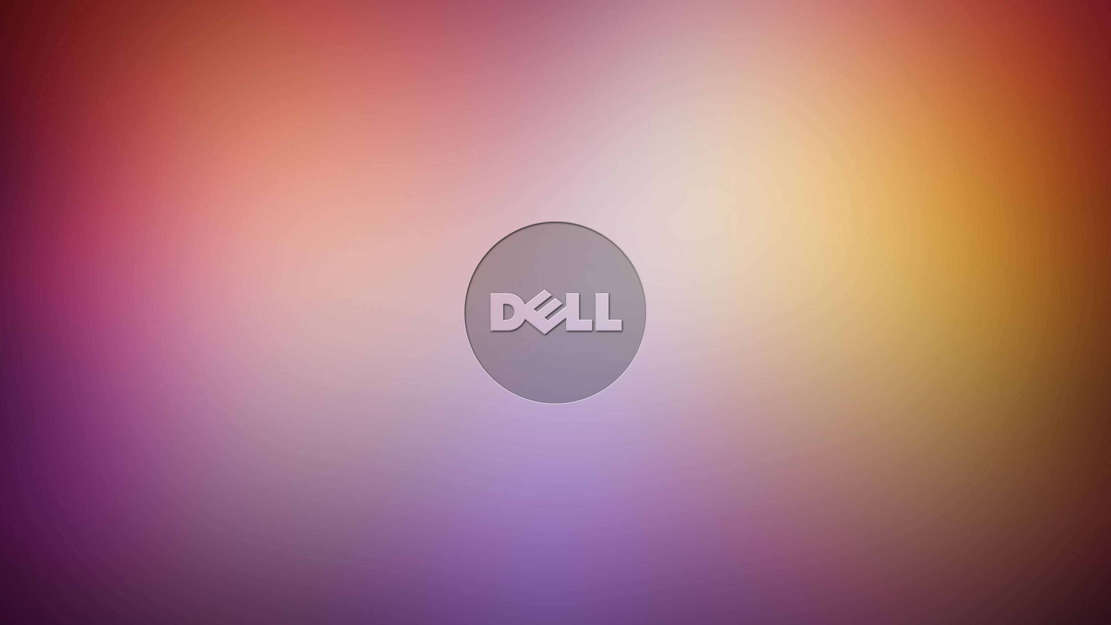 Dell Laptop 桌布 壁紙 — Dell 標誌居中於柔和漸變背景，混合紫色、粉紅色和橙色色調。