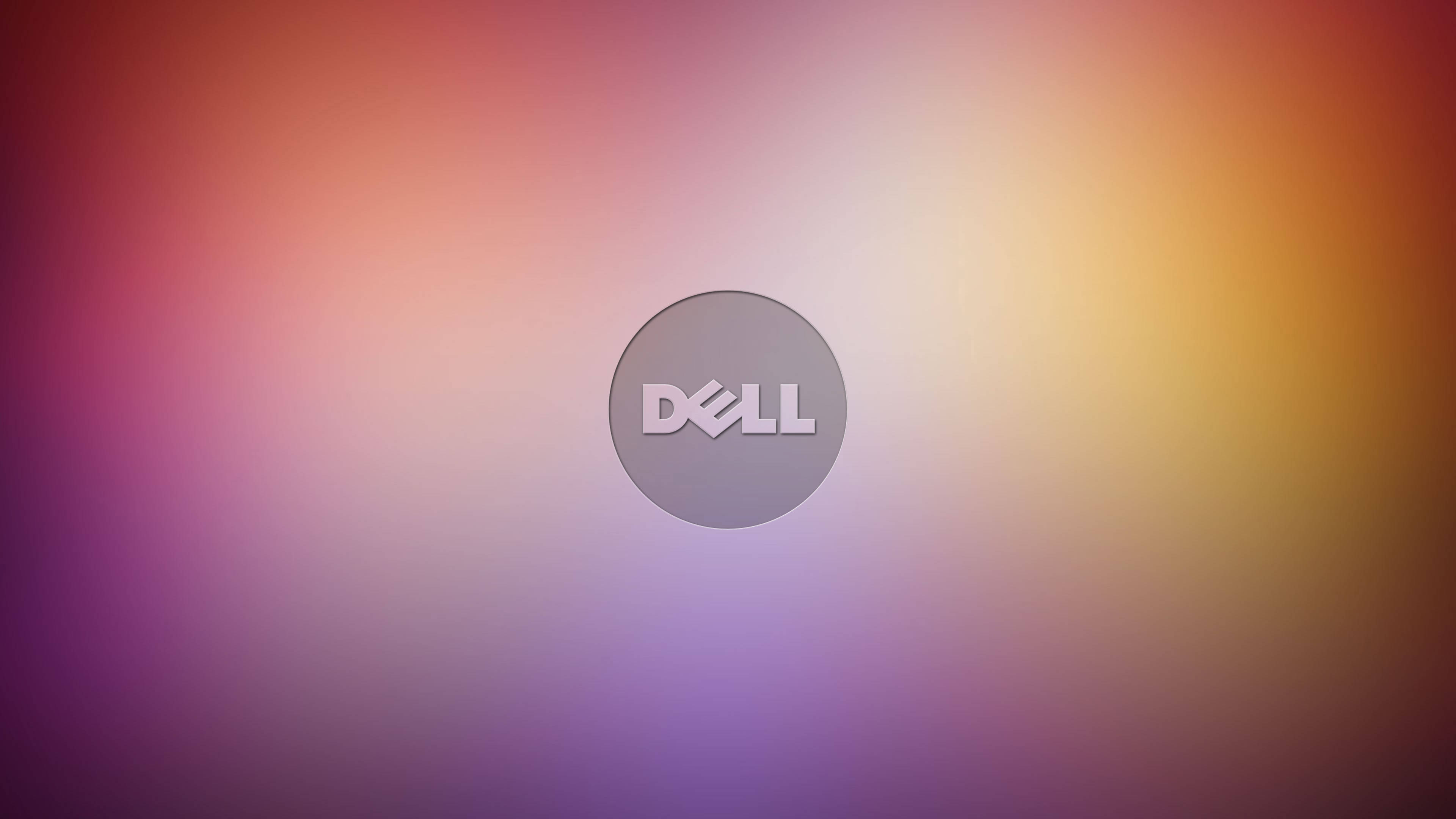 dell 4K 桌布 壁紙 — Dell 標誌居中於柔和漸變背景上，混合紫色、粉紅色和橙色色調。