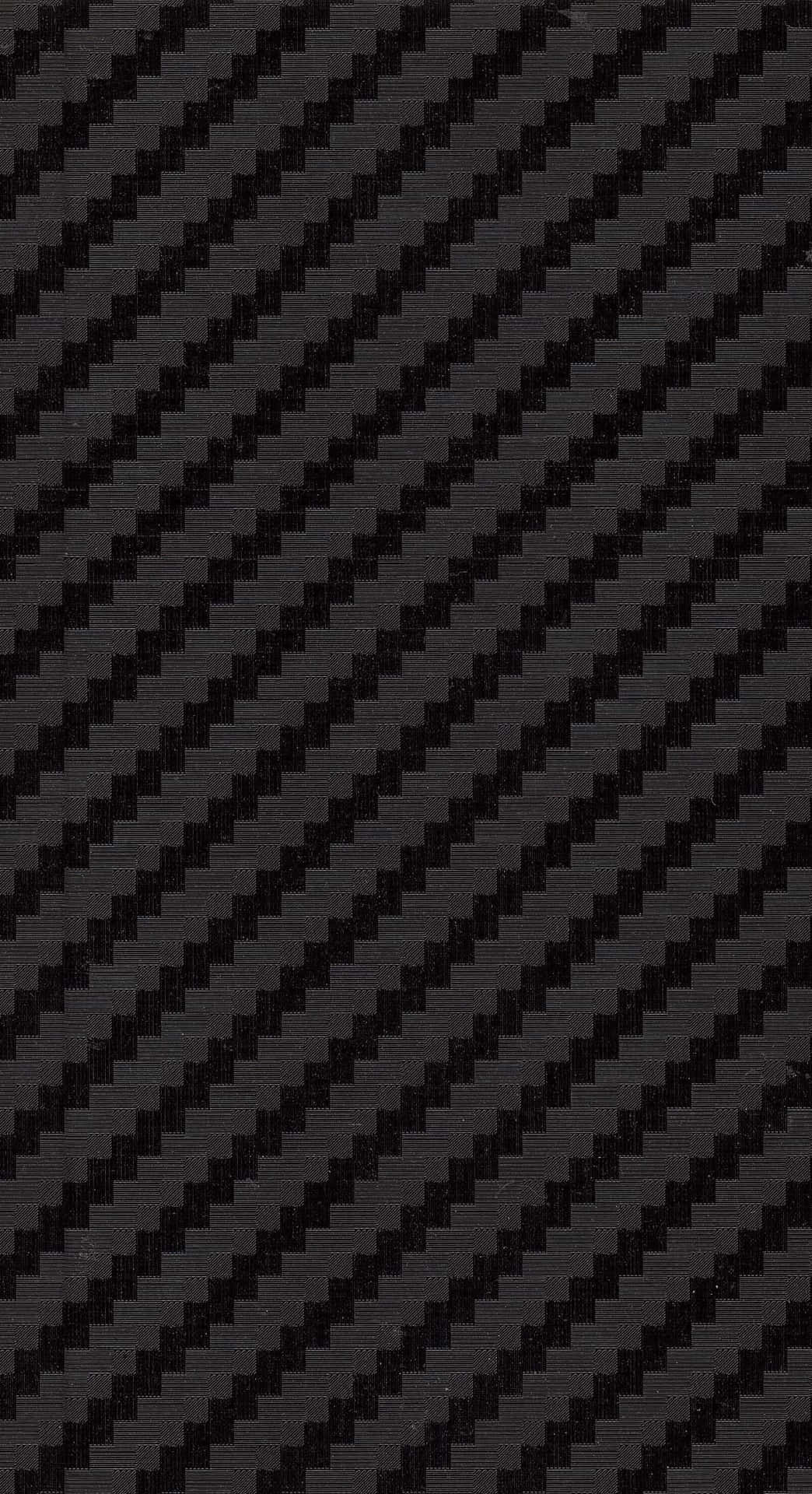 Carbon 桌布 壁紙 — 深灰色和黑色的斜紋碳纖維編織圖案，帶有細微紋理和光澤。