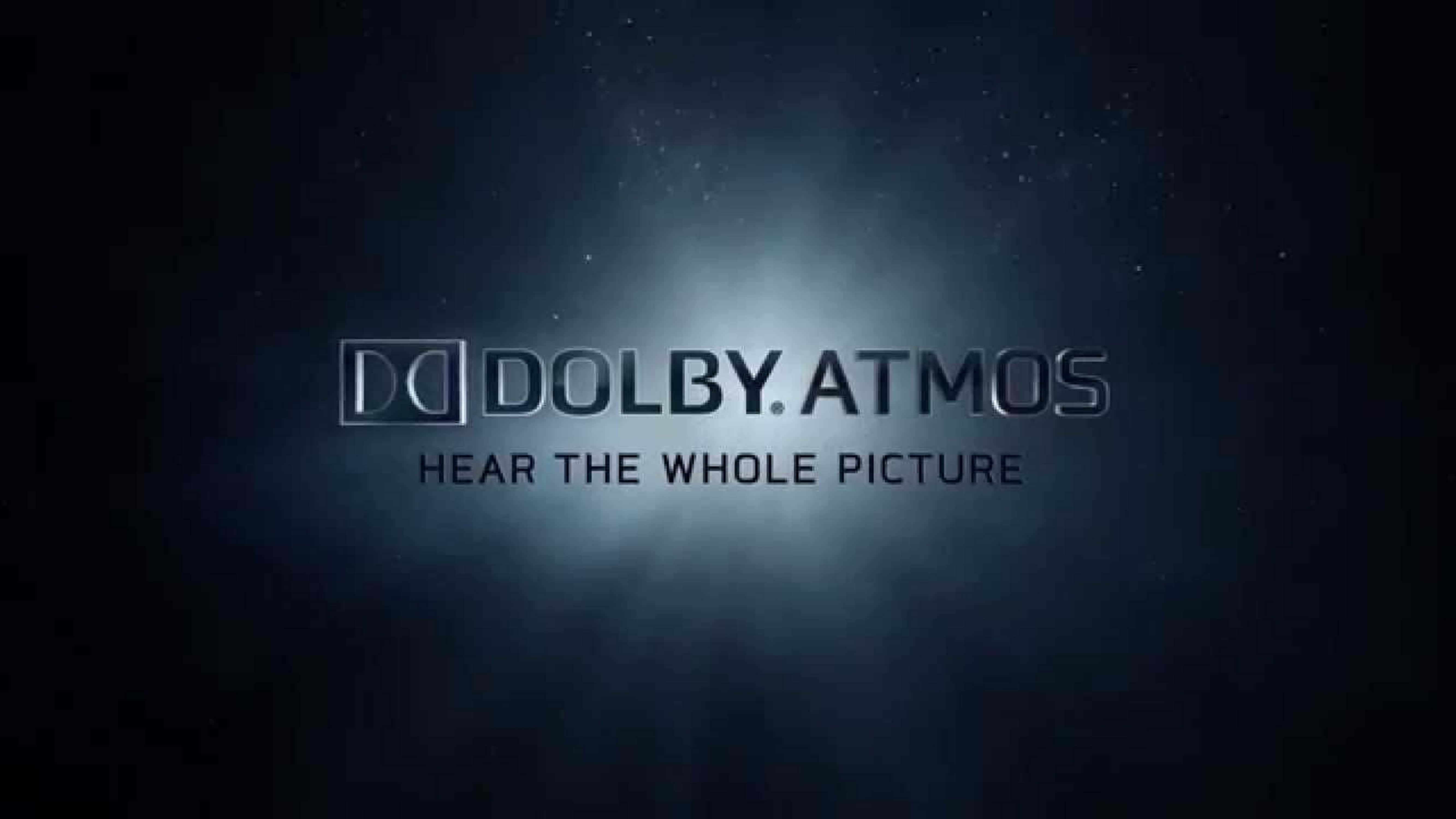 4K Dolby Vision 桌布 壁紙 — Dolby Atmos 標誌在黑暗星空背景下散發柔和藍色光暈，並帶有標語 hear the whole picture。