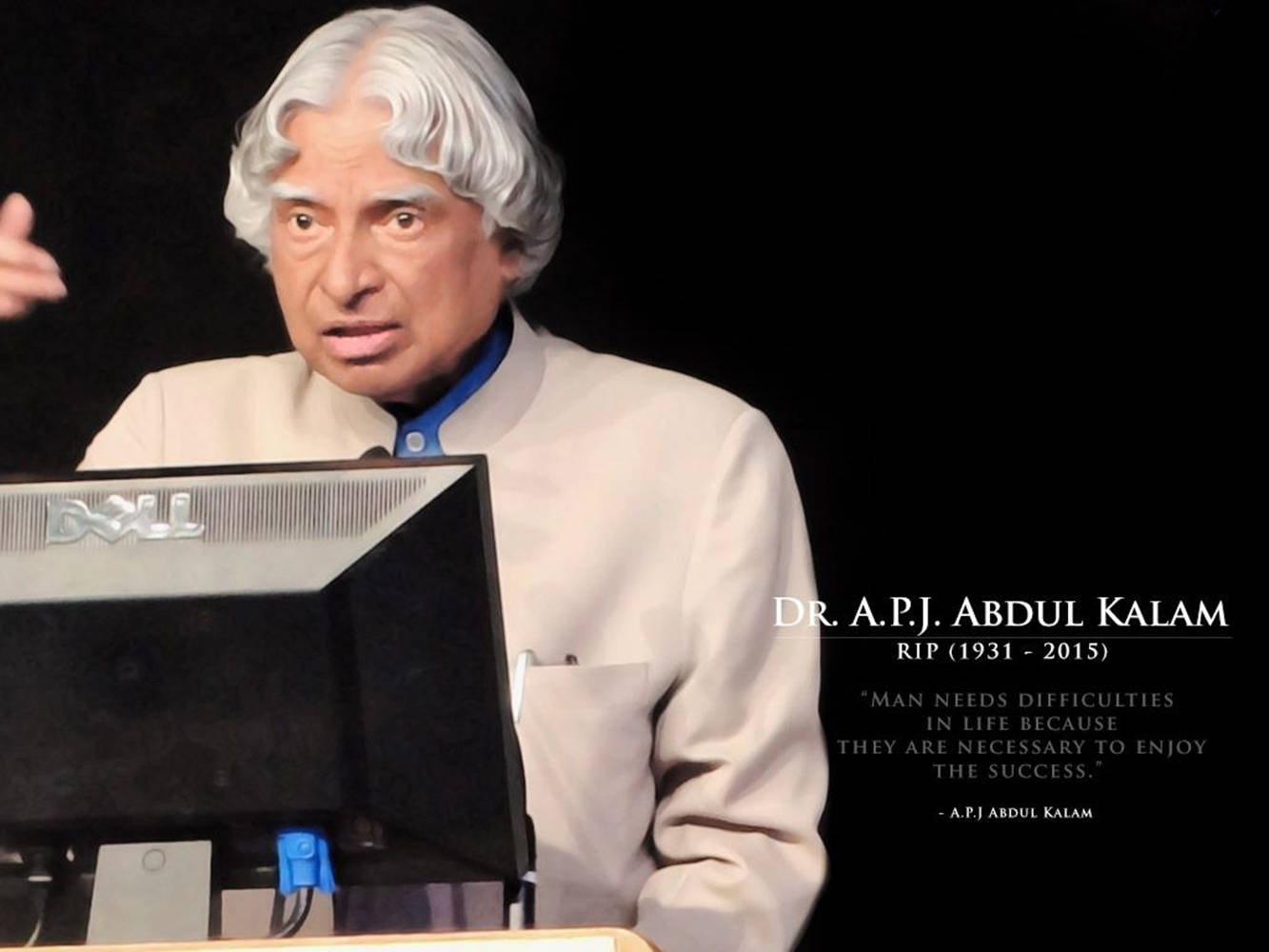 語錄 桌布 壁紙 — Dr A P J Abdul Kalam 在黑色背景前，於講台上發言，面前放著一部Dell顯示器。