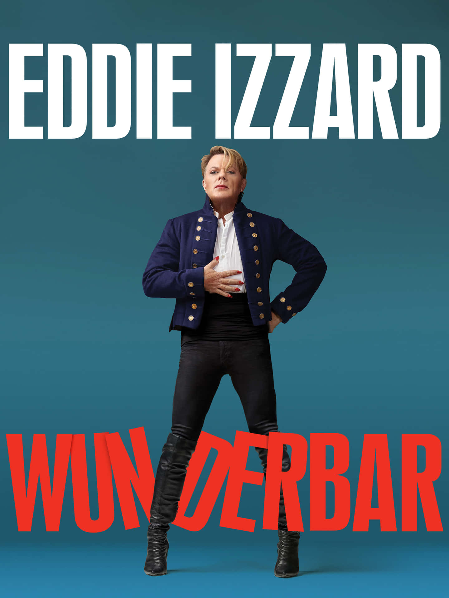 Eddie Izzard 身穿海軍藍外套和黑色長褲，搭配紅色和白色文字擺姿勢。 — Michael B Jordan 壁紙