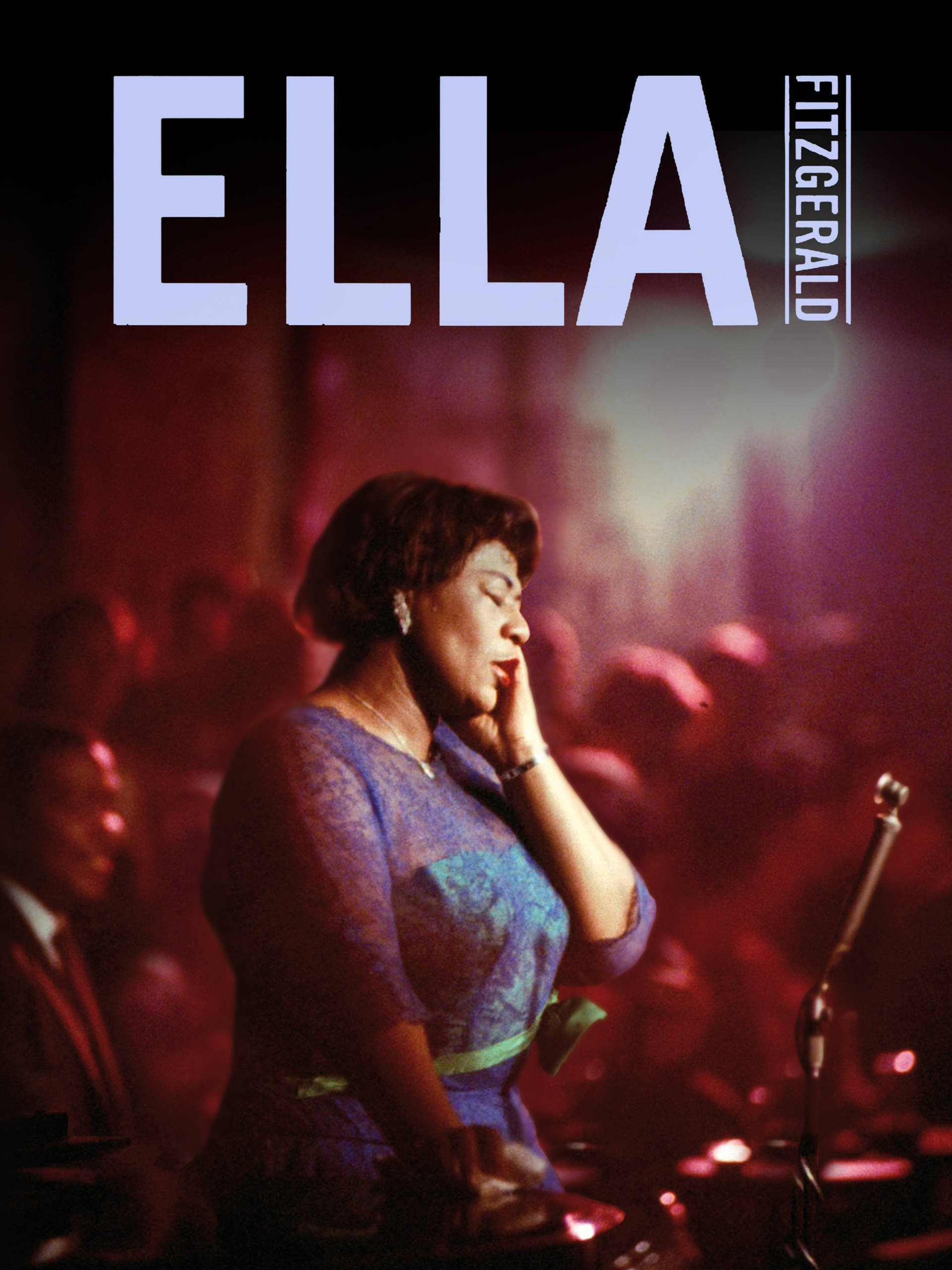 Ella 桌布 壁紙 — Ella Fitzgerald 在昏暗的爵士俱樂部中，在紅色環境燈光和面前的麥克風下深情演唱。
