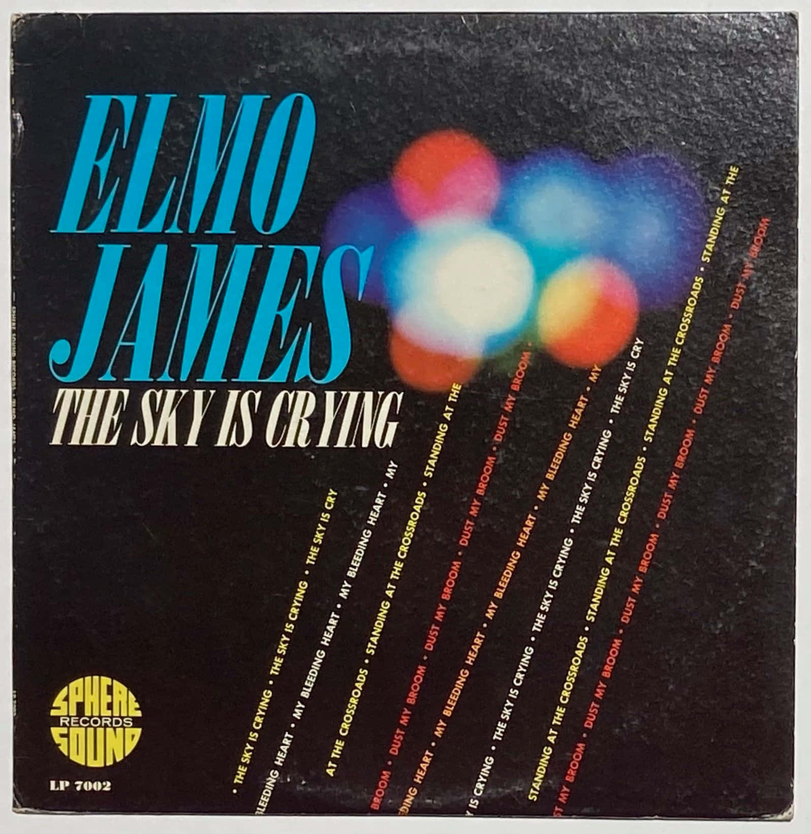 artist 桌布 壁紙 — Elmo James 的復古專輯封面，採用粗體藍色字體和彩色散景燈光，背景為黑色。
