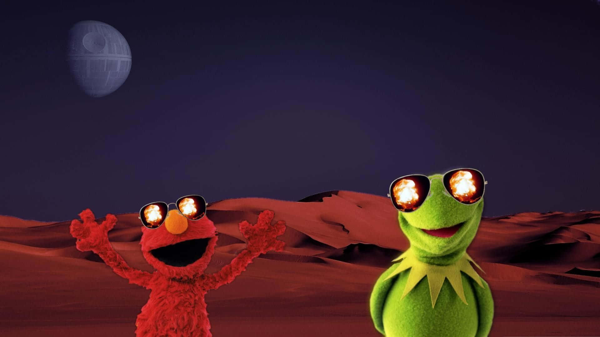 火星 桌布 壁紙 — Elmo 和青蛙 Kermit 戴著火焰色鏡片的太陽眼鏡，站在紅色沙漠上，上方是死星月亮。