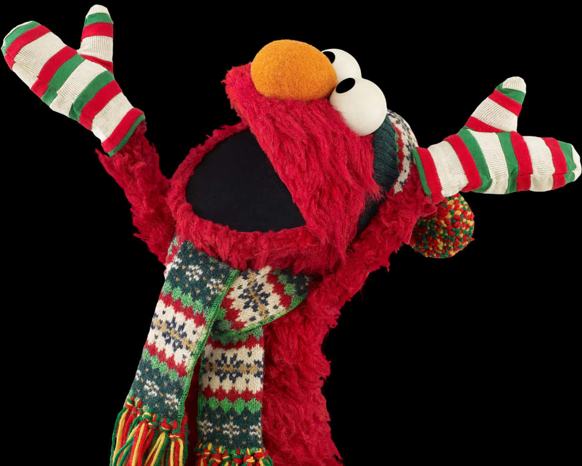 Elmo 桌布 壁紙 — Elmo 木偶戴著節日條紋手套和圖案圍巾，在黑色背景前高興地舉起雙臂。