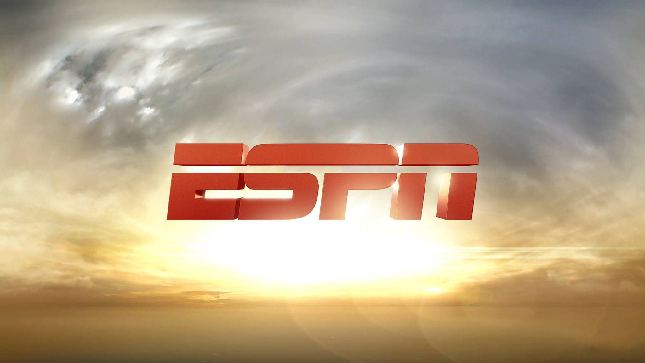 Espn 桌布 壁紙 — ESPN 標誌在戲劇性的日落天空背景下，以粗體紅色發光，伴隨著旋轉的雲彩和耀眼的光芒。