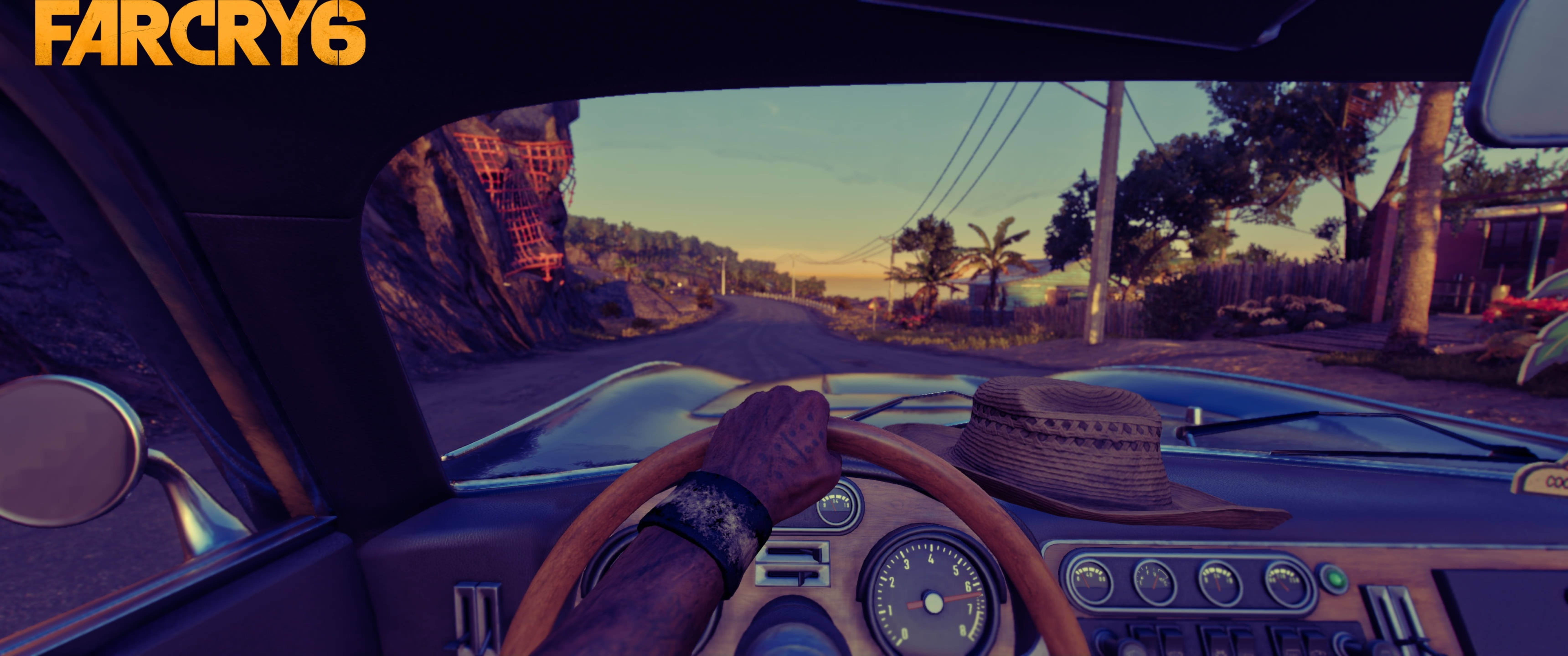 Far Cry 6 桌布 壁紙 — 《Far Cry 6》中，從一輛經典車內部以第一人稱視角在日落時分行駛在塵土飛揚的道路上。